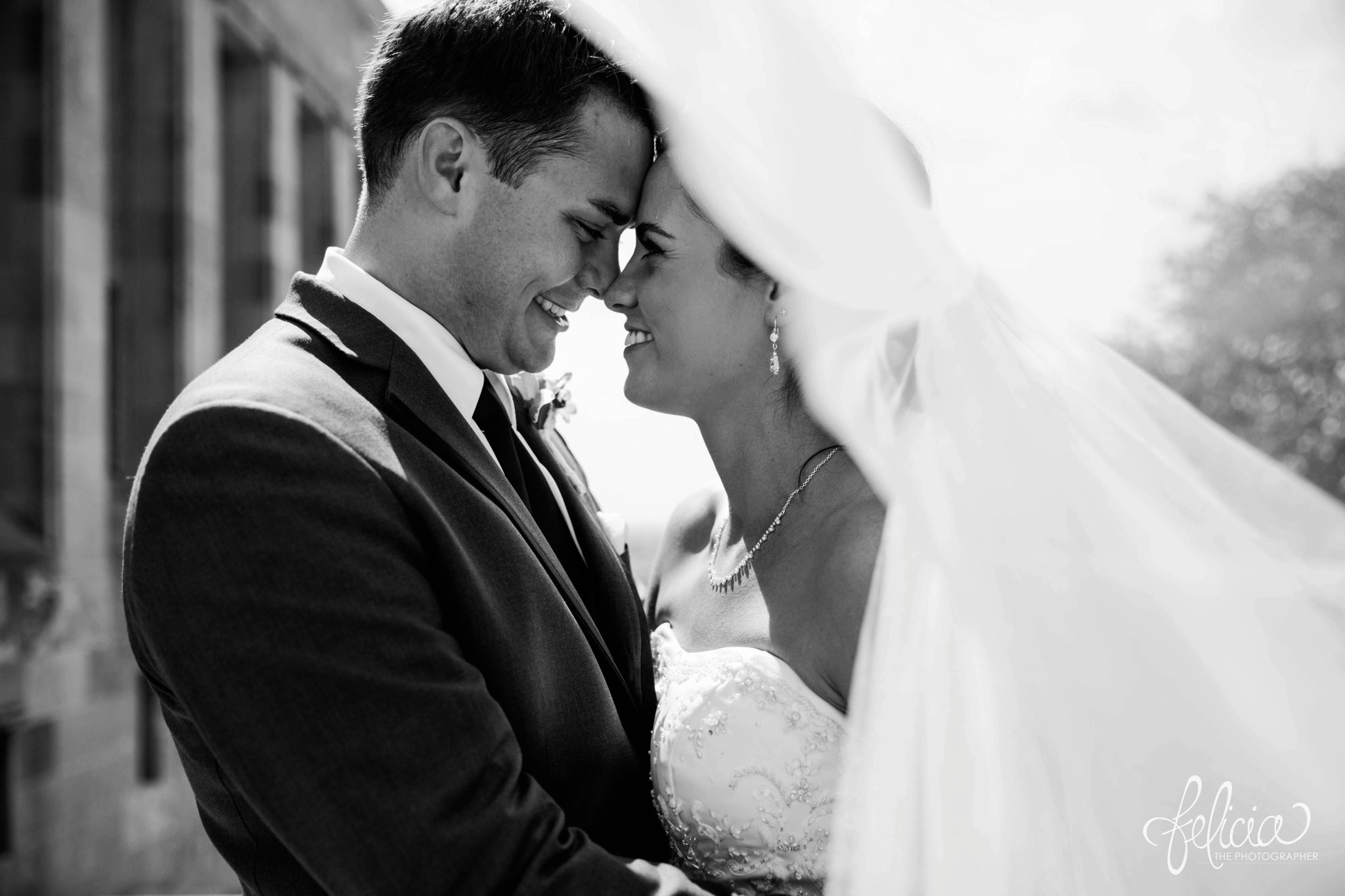 Hilton KCI Wedding | Felicia The Photographer | Bride and Groom Under Veil | Black and White