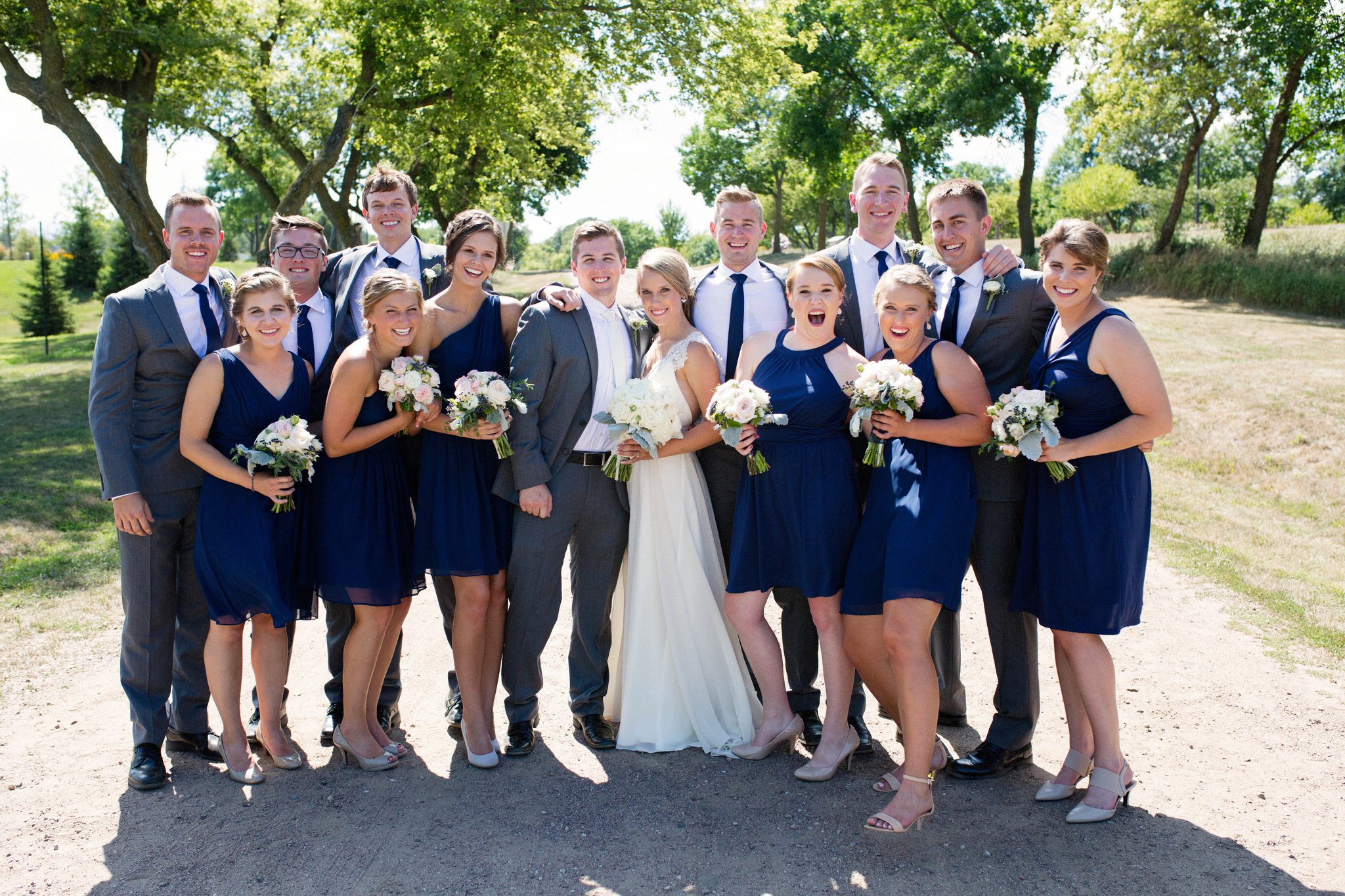 Sioux Falls Wedding Photos | Destination Photographer | Felicia The Photographer | Mary Jo Wegner Arboretum | Bridal Party | Navy one shoulder dresses | Fun | Casual