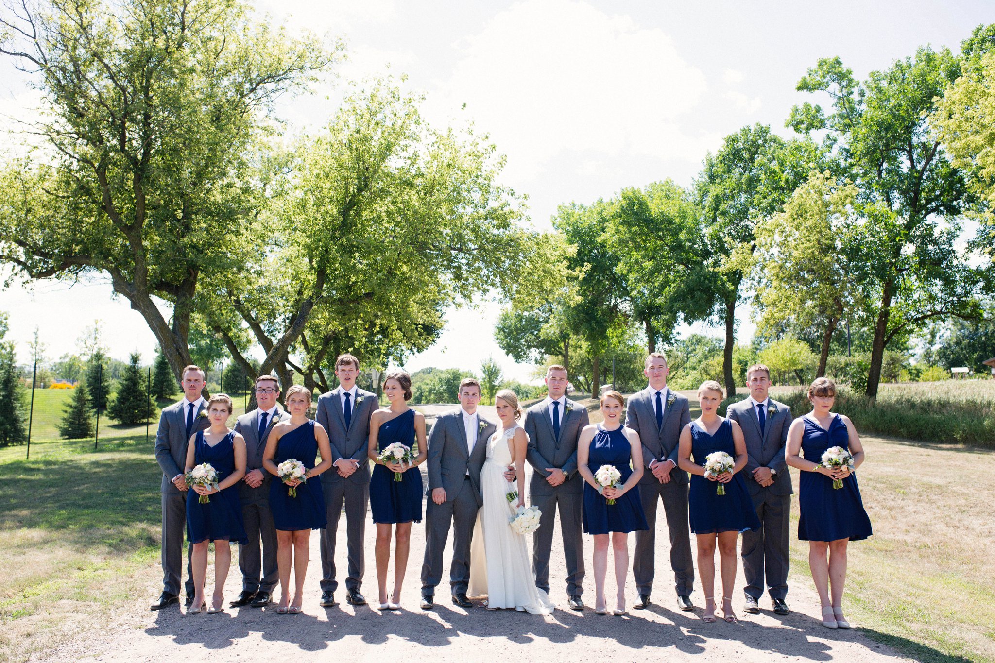 Sioux Falls Wedding Photos | Destination Photographer | Felicia The Photographer | Mary Jo Wegner Arboretum | Bridal Party | Navy one shoulder dresses | serious | indie | Hipster