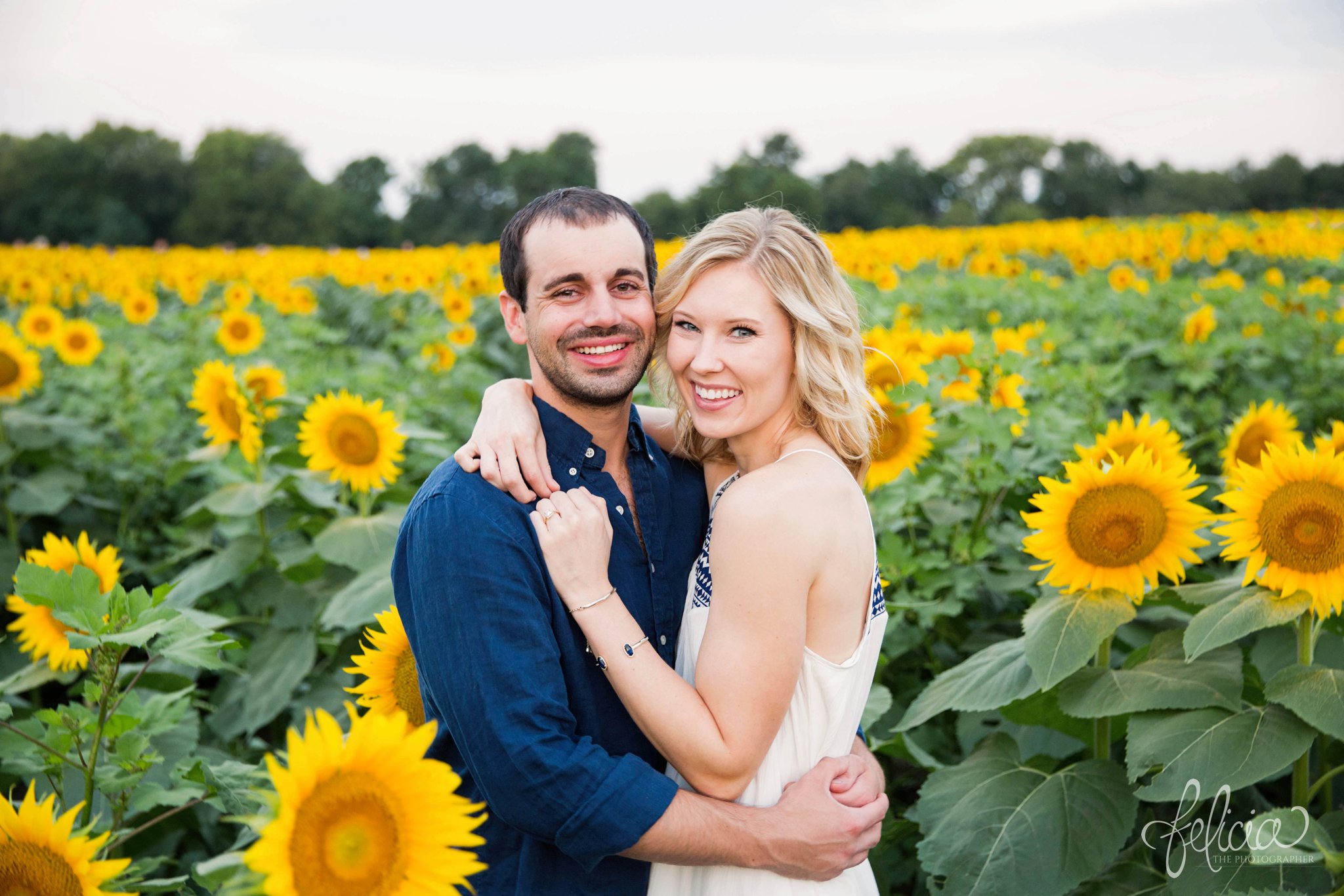 Sunrise Engagement Photos | Felicia The Photographer | Sunflower field | looking at camera