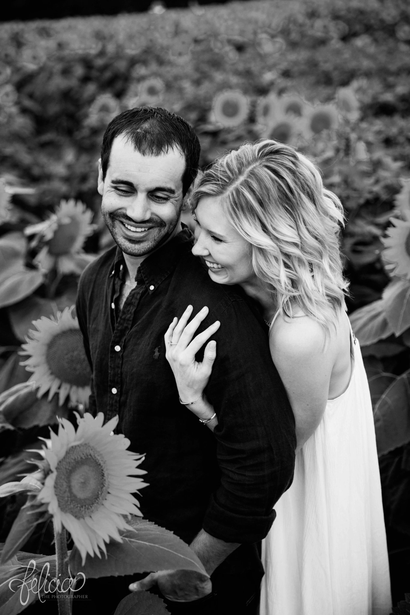 Sunrise Engagement Photos | Felicia The Photographer | Sunflower field | hug from behind | Black and White | Laughing