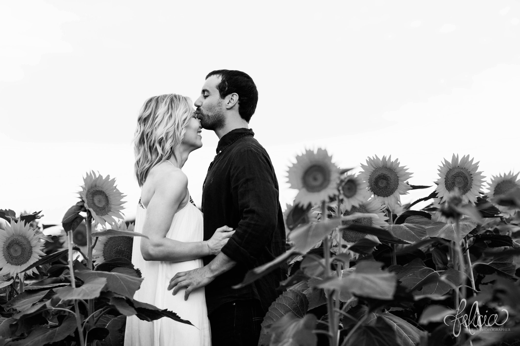 Sunrise Engagement Photos | Felicia The Photographer | Sunflower field | forehead kiss | Black and White | Laughing