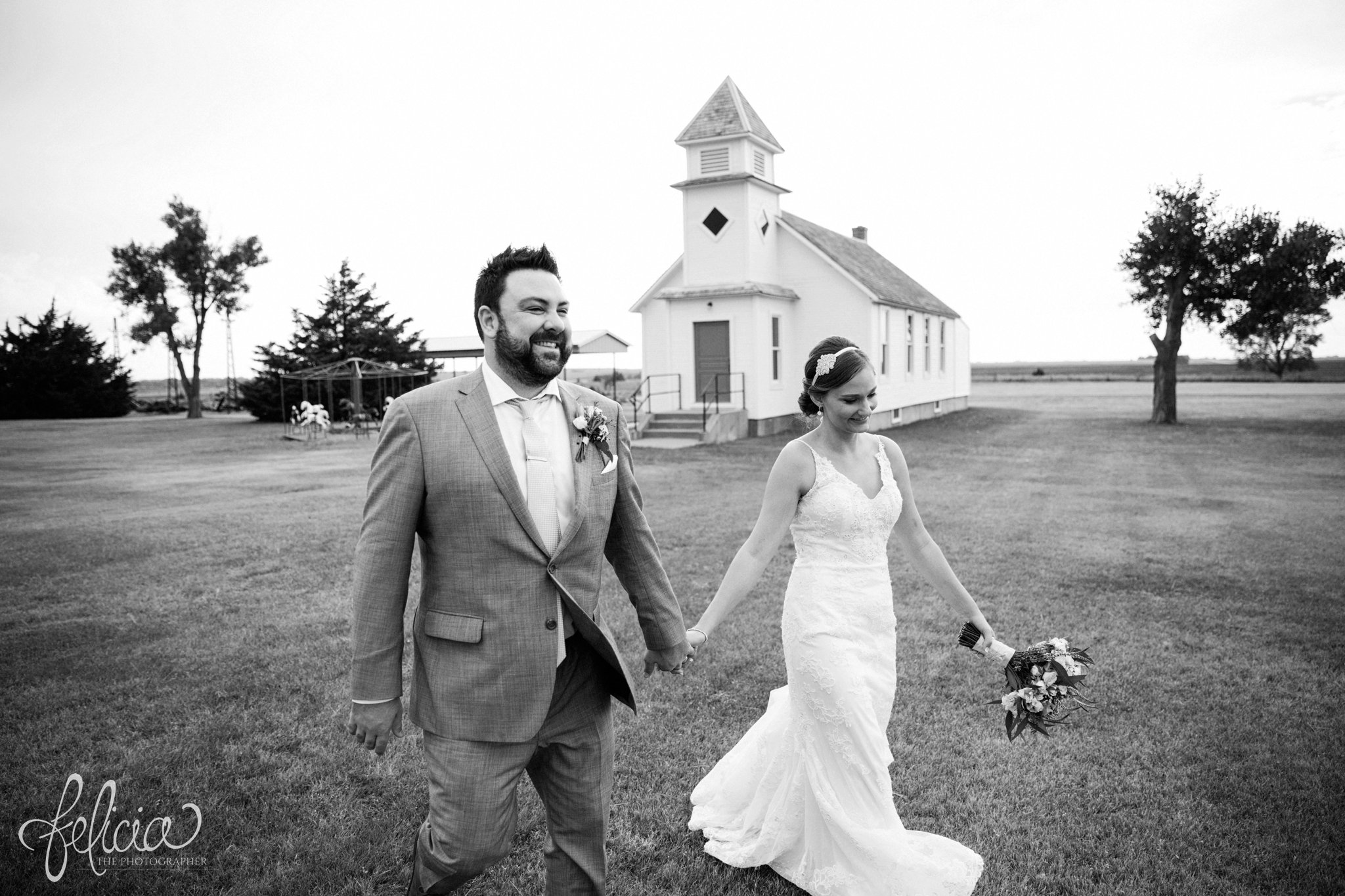 Black and White | Wedding | Wedding Photography | Wedding Photos | Travel Photographer | Images by feliciathephotographer.com | Kansas | Bride and Groom Portrait | Walking | Candid | Holding Hands | Chapel 
