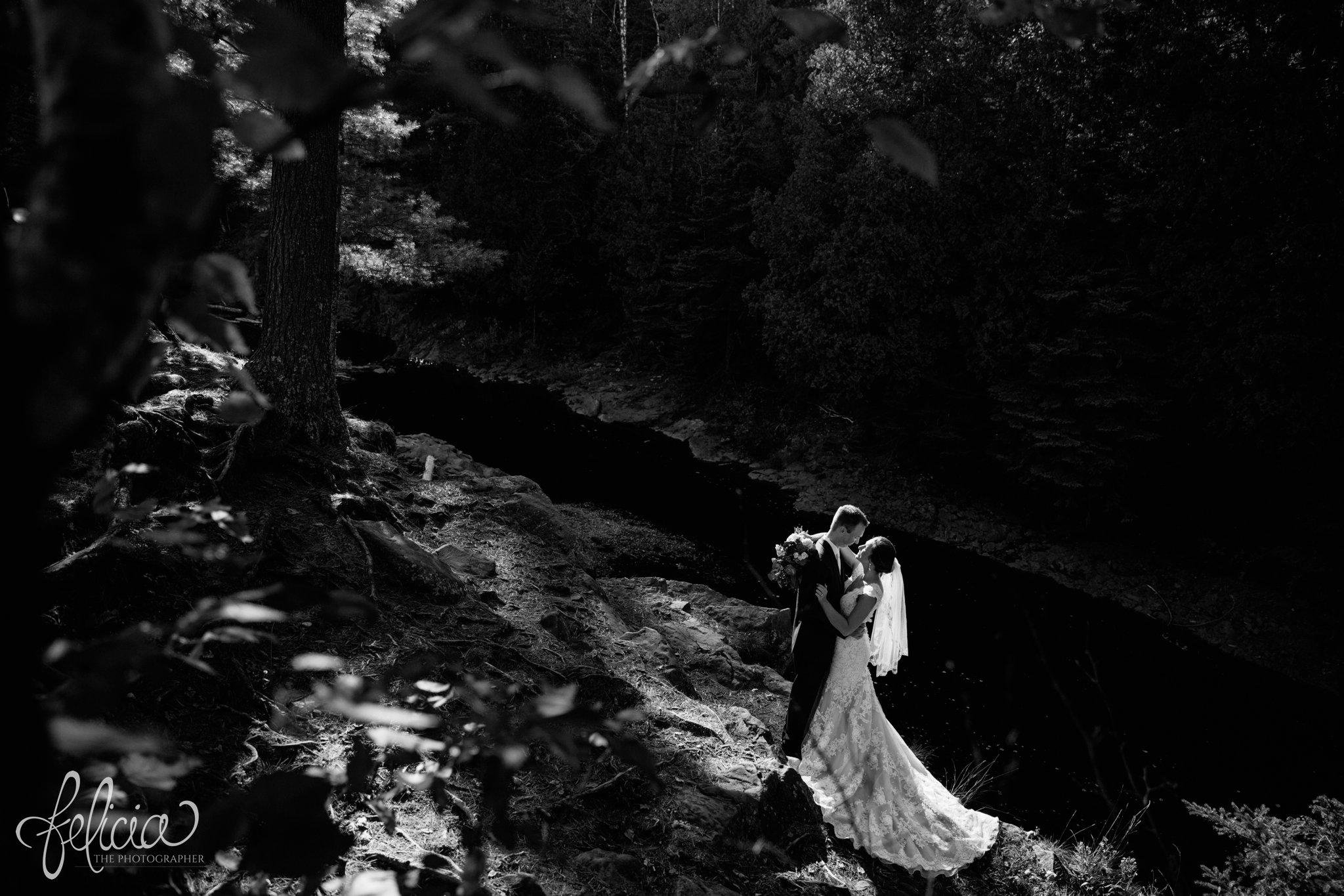 Black and White | Wedding | Wedding Photography | Wedding Photos | Felicia the Photographer | Images by feliciathephotographer.com | Travel Photographer | Duluth | St. Benedict Church | Christian Lane Bridal | Bride and Groom Portrait | Stream | Nature | Evergreen | Forest | Sun Flare | Dramatic | Train 