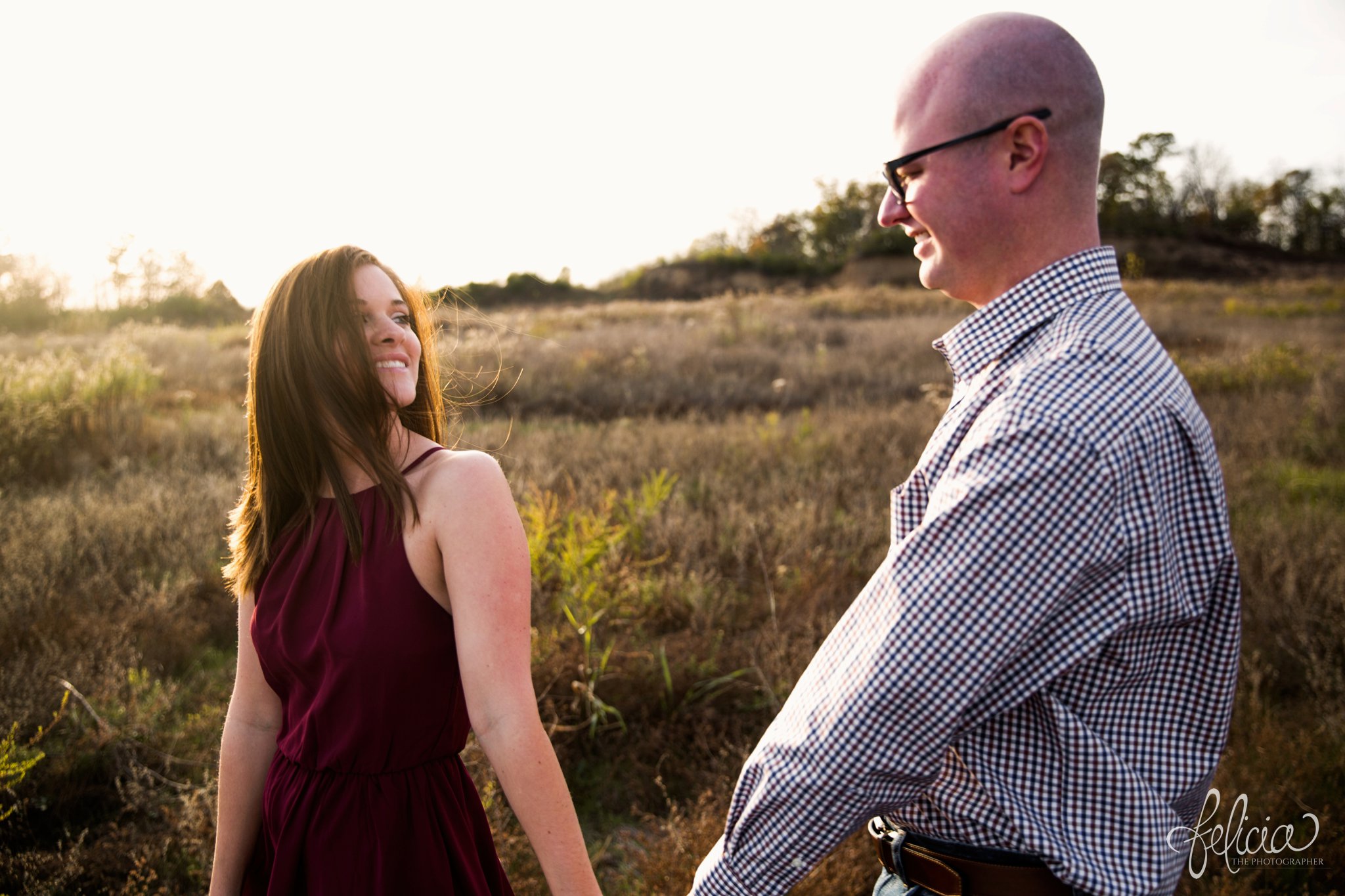 engagement pictures | engagement photos | nature | golden hour | sunset | sunset photography | fall | autumn | burgundy | hand holding | sweet smiles | field | serene | peaceful 