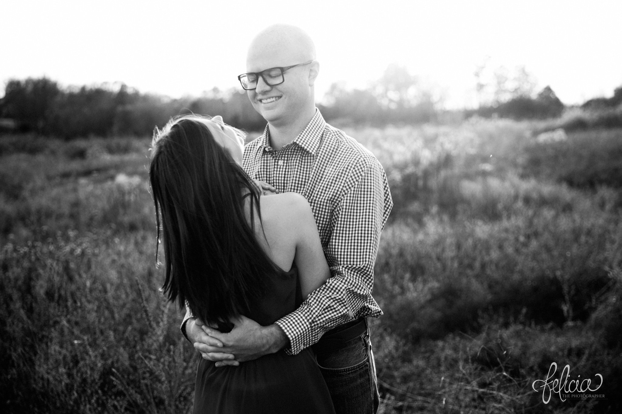 black and white | engagement pictures | engagement photos | nature | golden hour | sunset | sunset photography | fall | autumn | burgundy | hugs | candid | laughter | sun flare 