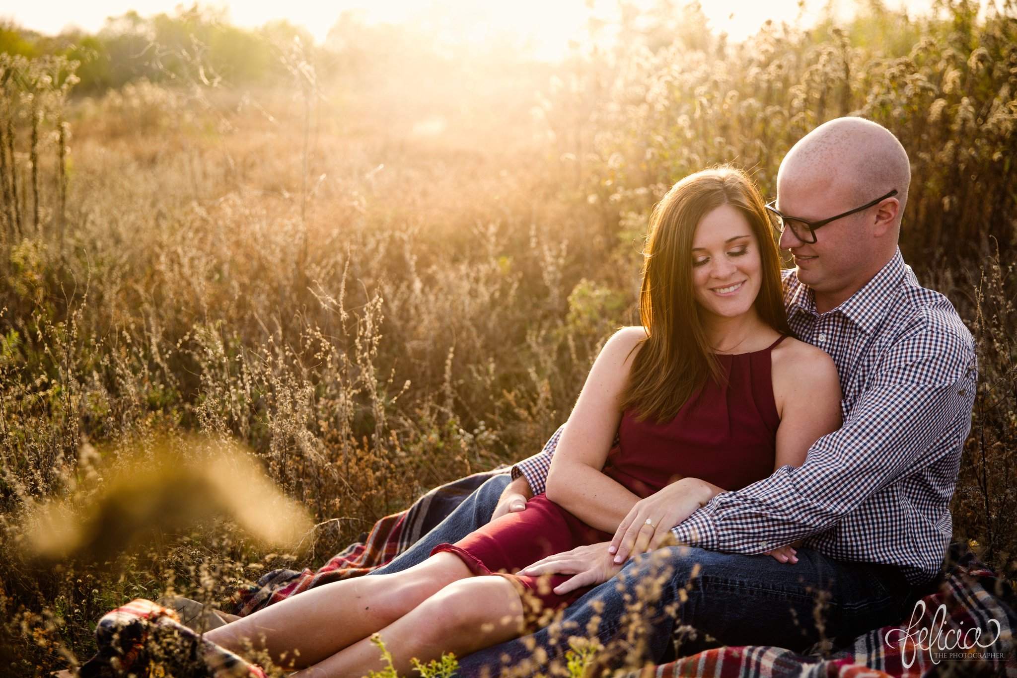 engagement pictures | engagement photos | nature | golden hour | sunset | sunset photography | fall | autumn | burgundy | laying in a field | lounging | sun flare | casual poses | picnic 