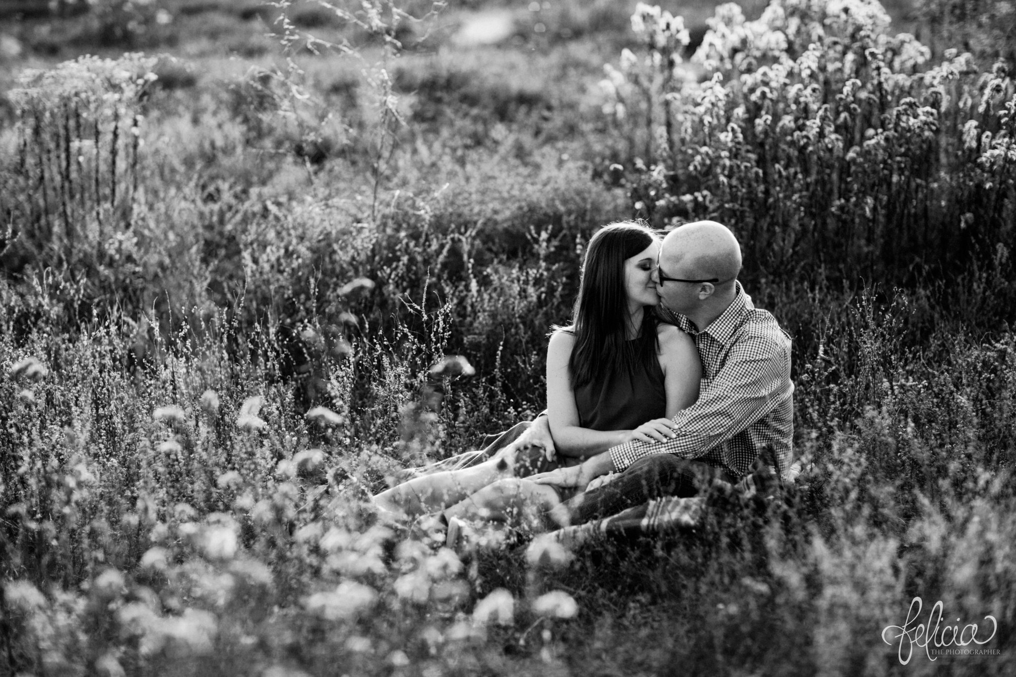 black and white | engagement pictures | engagement photos | nature | golden hour | sunset | sunset photography | fall | autumn | burgundy | laying in a field | lounging | kiss | kissing in a field | picnic 