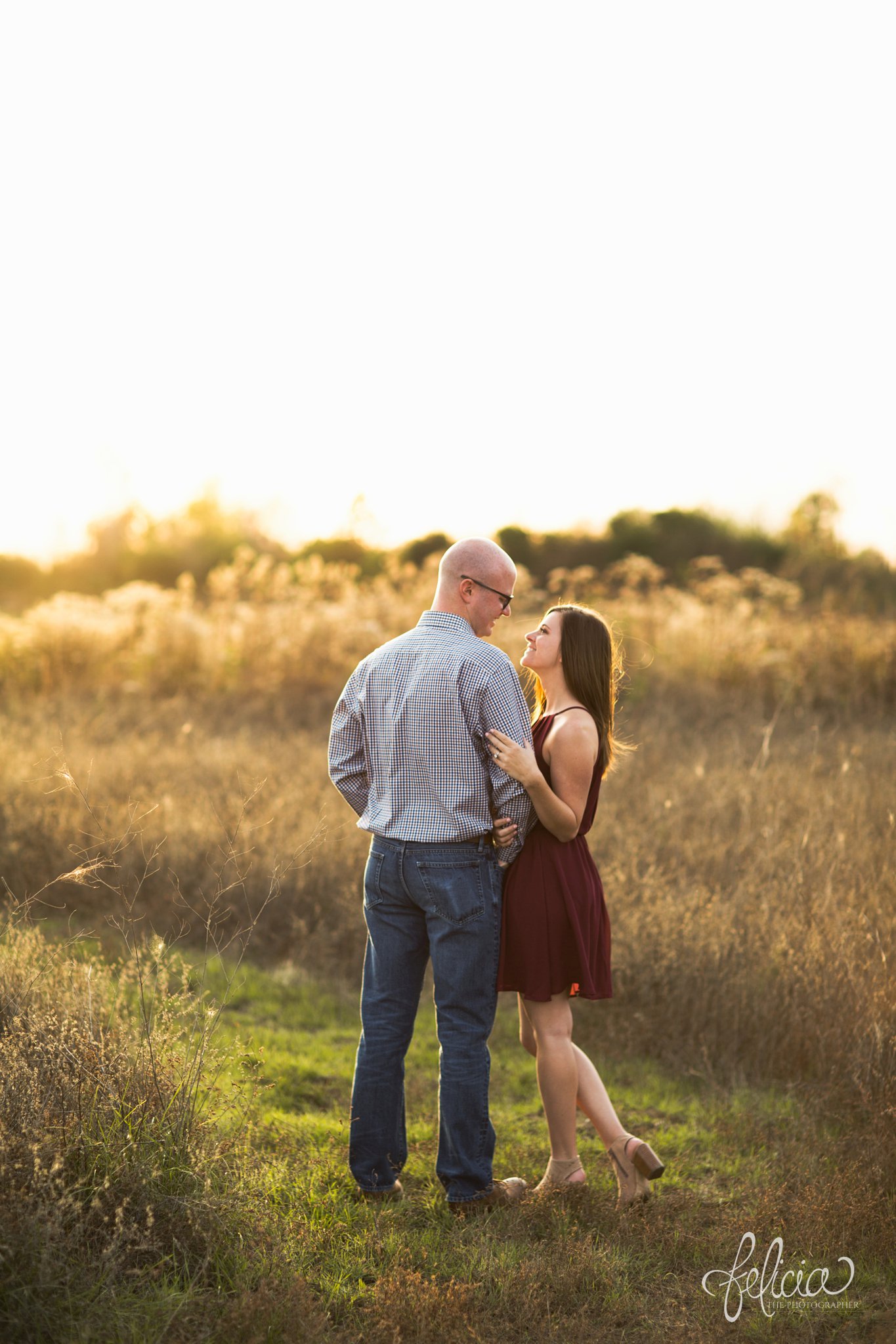 engagement pictures | engagement photos | nature | golden hour | sunset | sunset photography | fall | autumn | burgundy | natural | hugging | dance pose | sun flare 