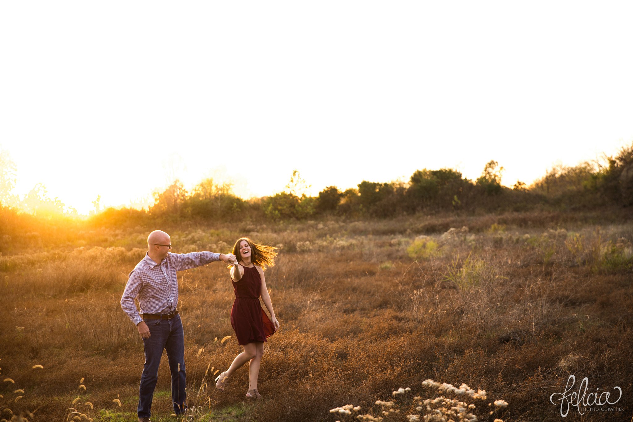 engagement pictures | engagement photos | nature | golden hour | sunset | sunset photography | fall | autumn | burgundy | natural | sun flare | expansive background | nature background | dance pose | twirl | candid 