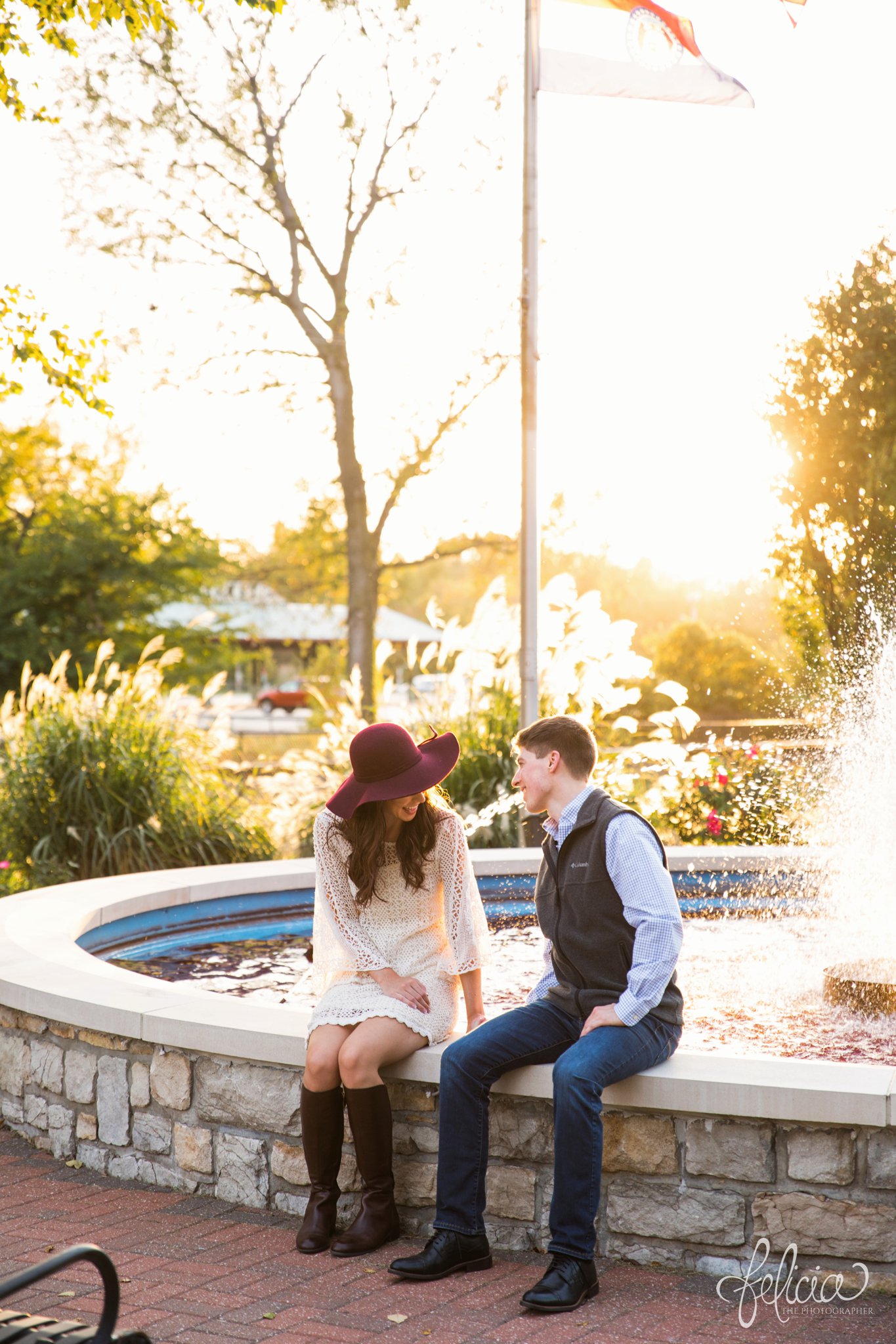 Engagement Photos | Engagement Photography | Sunset | Sunset Photography | Felicia the Photographer | Images by feliciathephotographer.com | Fall | Autumn | Lake | Sun Flare | Floppy Hat | Regal | Fountain | Candid | Laughter 