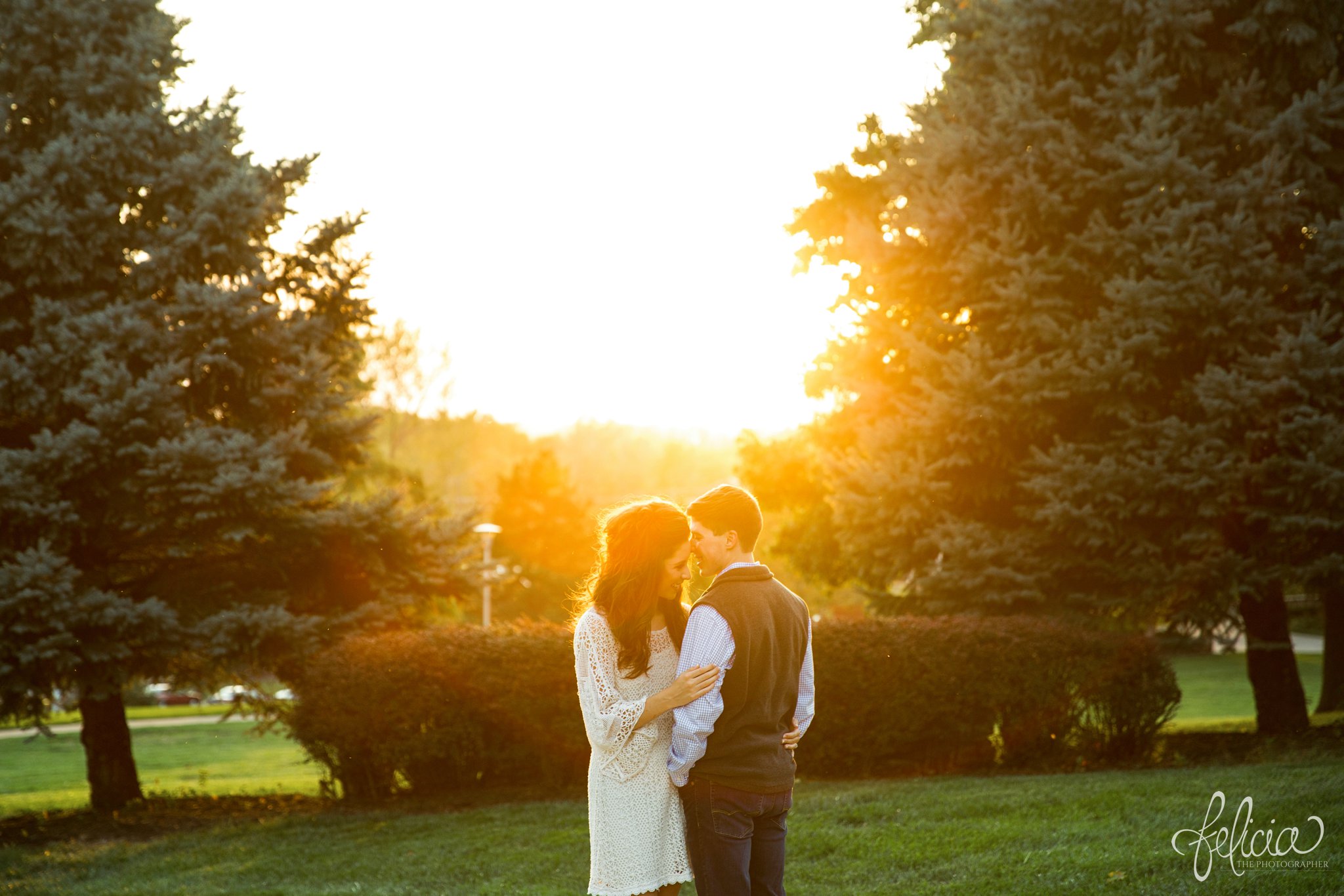 Engagement Photos | Engagement Photography | Sunset | Sunset Photography | Felicia the Photographer | Images by feliciathephotographer.com | Fall | Autumn | Lake | Sun Flare | Standing in Field 