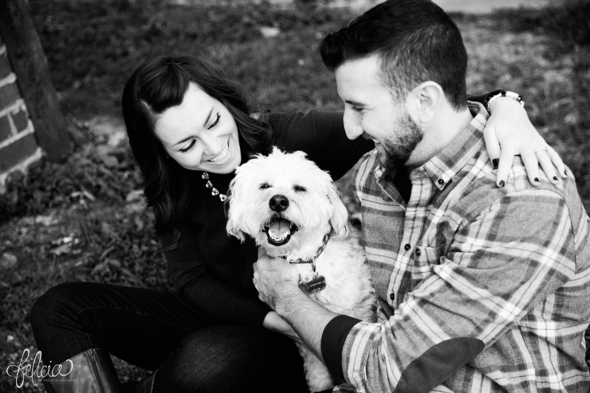 black and white | engagement photos | engagement photography | Kansas City | West Bottoms | images by feliciathephotographer.com | urban setting | industrial background | candid | engagement photos with dog | terrier 