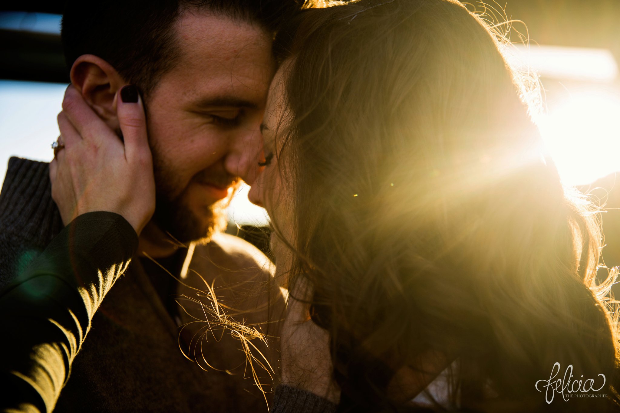 engagement photos | engagement photography | images by feliciathephotographer.com | Kansas City | West Bottoms | images by feliciathephotographer.com | urban setting | industrial background | sun flare | forehead touch | romantic pose | close up | head shot 