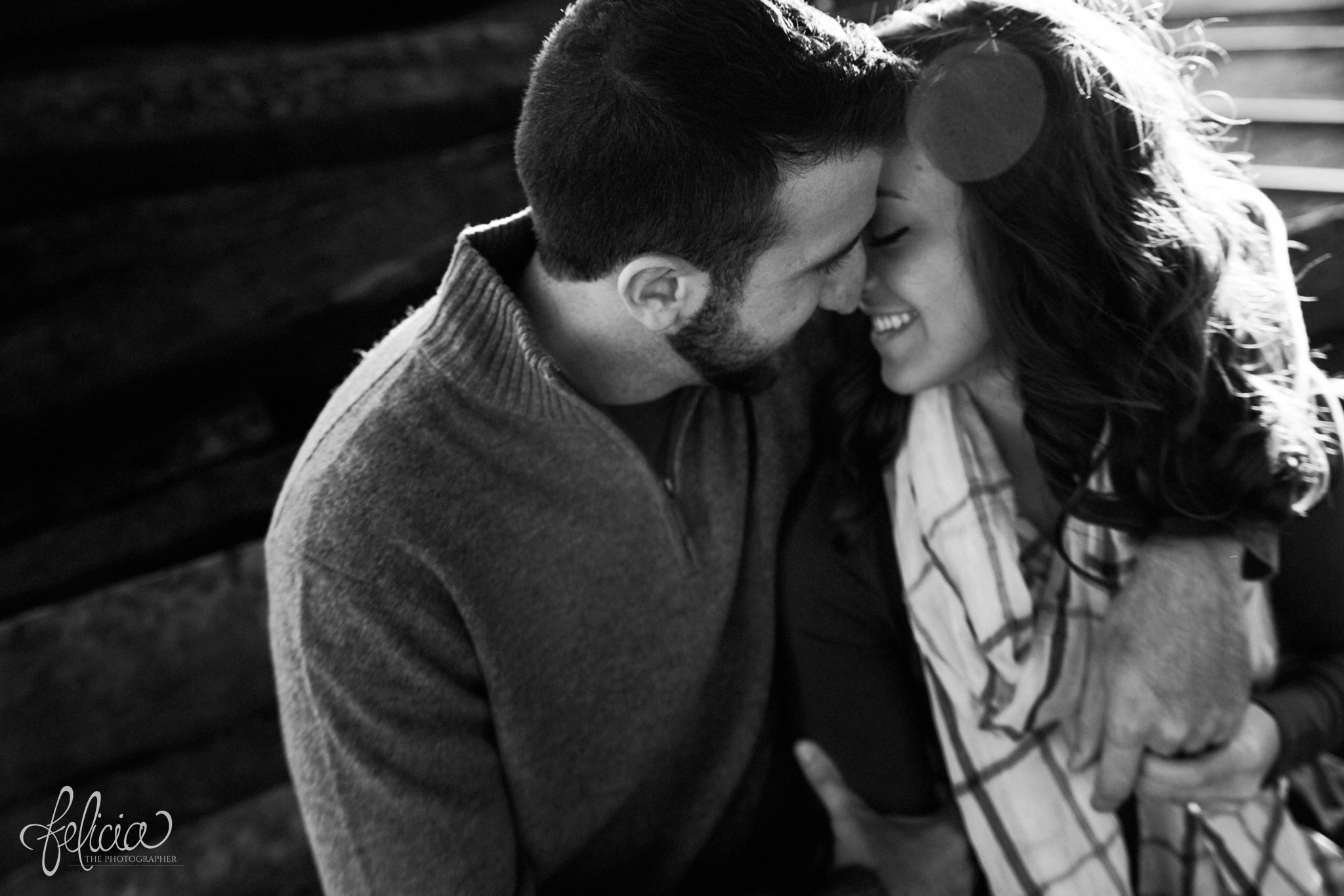 black and white | engagement photos | engagement photography | Kansas City | West Bottoms | images by feliciathephotographer.com | urban setting | industrial background | romantic pose | holding hands | cuddling | engagement shoot | kiss