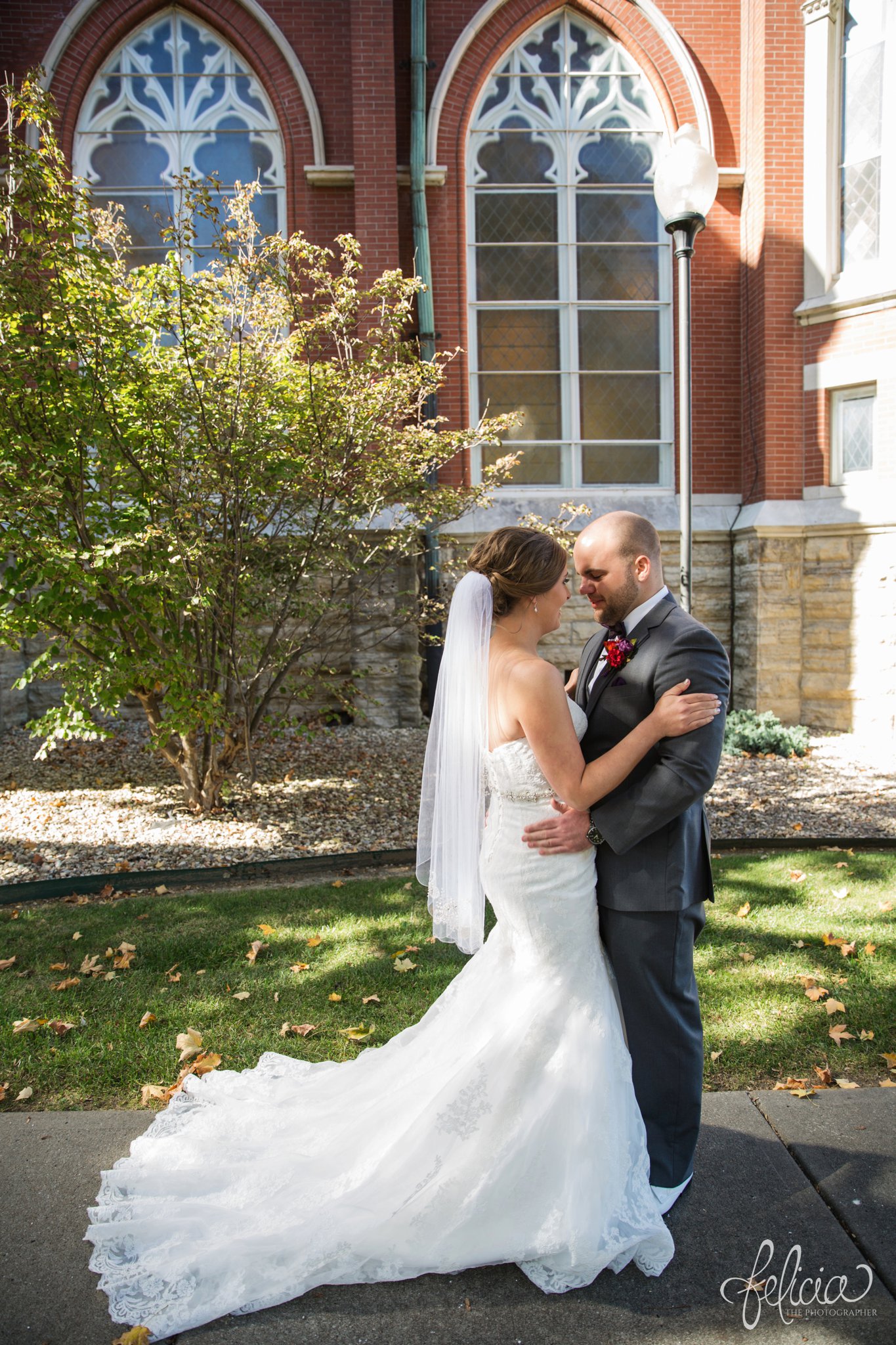 weddings | wedding photography | wedding photos | images by feliciathephotographer.com | St. Francis Xavier Church | Moila Country Club | autumn wedding | fall wedding | fall colors | harvest | purple and orange | Kansas City | St. Joseph | harvest inspiration | first look | bride and groom classic pose | stain glass windows | architectural background 