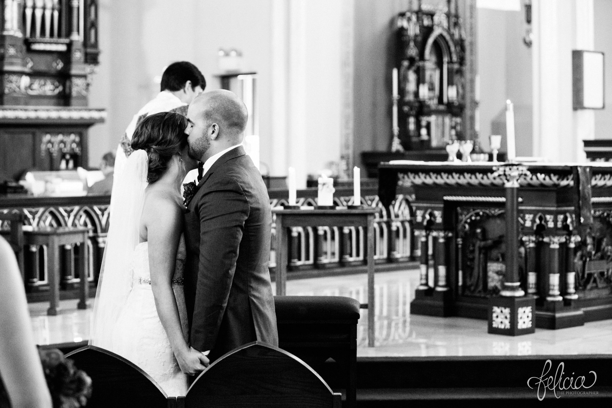 black and white | weddings | wedding photography | wedding photos | images by feliciathephotographer.com | St. Francis Xavier Church | Moila Country Club | autumn wedding | fall wedding | fall colors | harvest | purple and orange | Kansas City | St. Joseph | harvest inspiration | wedding ceremony | church photos | bride and groom | forehead kiss 