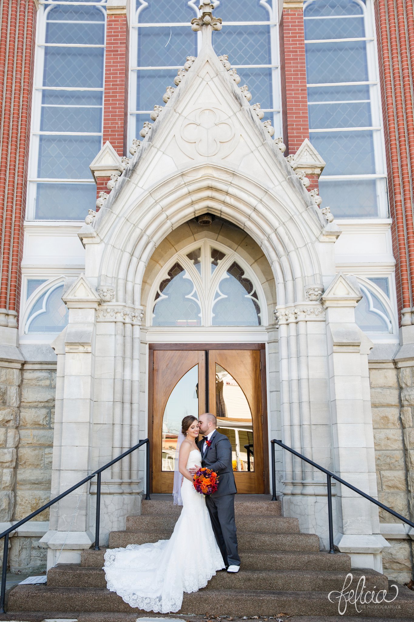 black and white | weddings | wedding photography | wedding photos | images by feliciathephotographer.com | St. Francis Xavier Church | Moila Country Club | autumn wedding | fall wedding | fall colors | harvest | purple and orange | Kansas City | St. Joseph | harvest inspiration | bride and groom portraits | church entrance | kiss on cheek | long train 