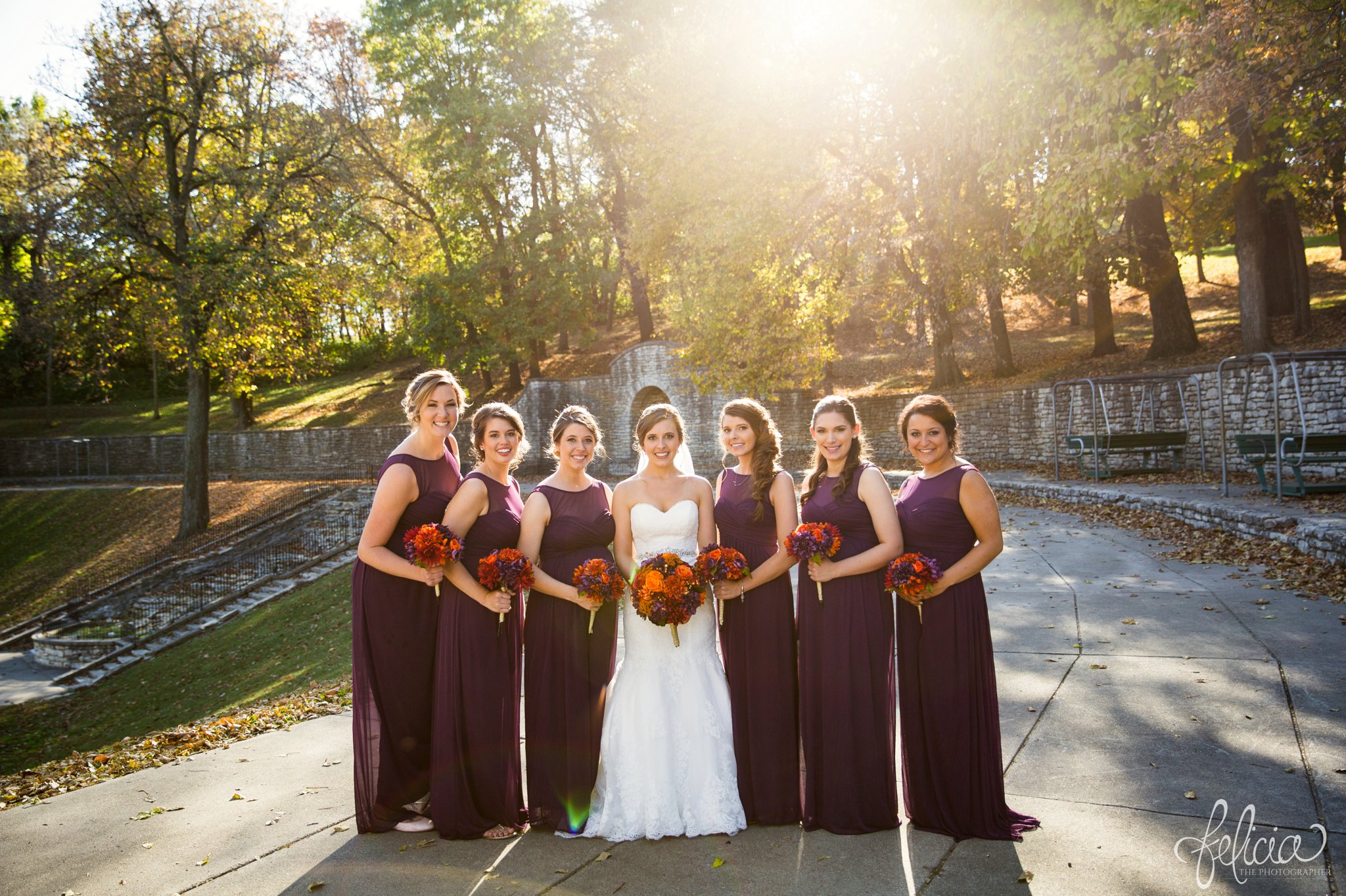 weddings | wedding photography | wedding photos | images by feliciathephotographer.com | St. Francis Xavier Church | Moila Country Club | autumn wedding | fall wedding | fall colors | harvest | purple and orange | Kansas City | St. Joseph | harvest inspiration | bride with bridesmaids | bridesmaid portraits | bridal party | sun flare | nature | fall leaves | purple bridesmaid dresses | long bridesmaid dresses 