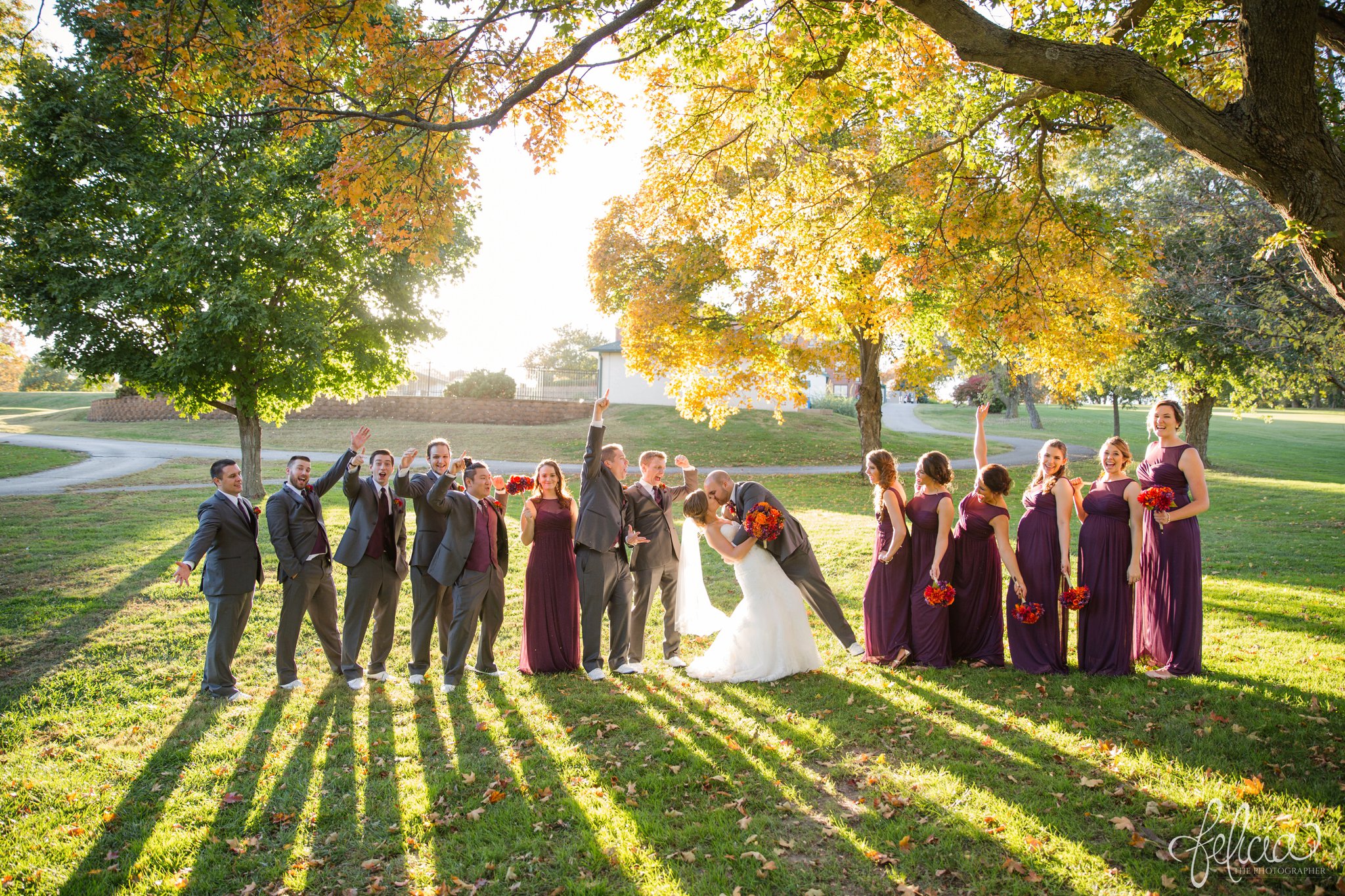 weddings | wedding photography | wedding photos | images by feliciathephotographer.com | St. Francis Xavier Church | Moila Country Club | autumn wedding | fall wedding | fall colors | harvest | purple and orange | Kansas City | St. Joseph | harvest inspiration | bridal party portraits | fall leaves | candid | bride and groom kiss | dip | golden hour 