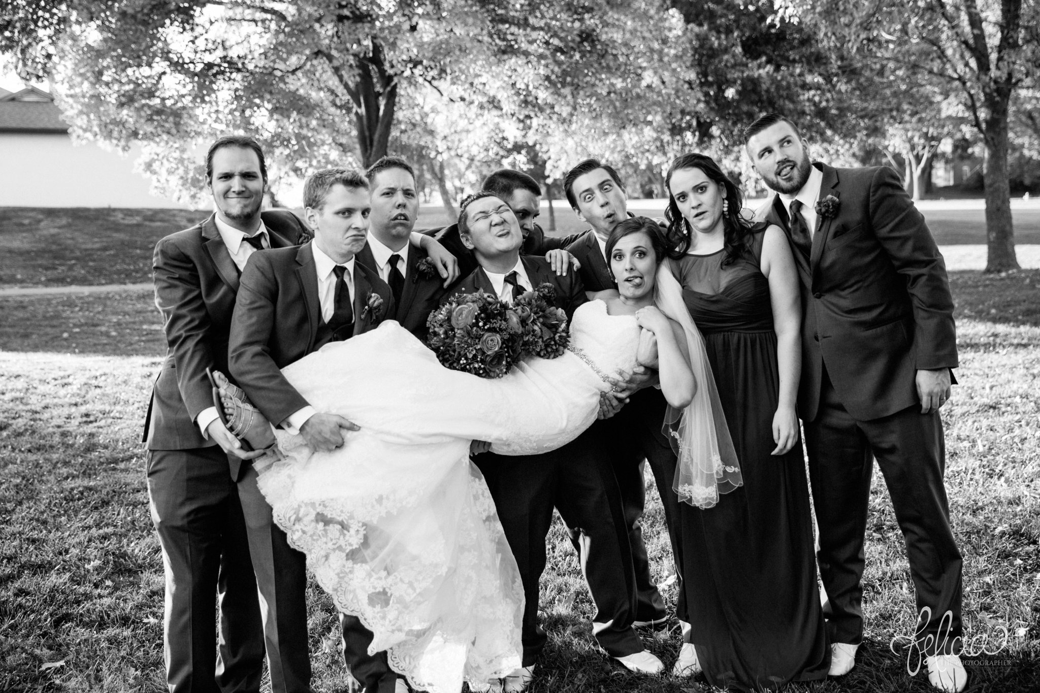 black and white | weddings | wedding photography | wedding photos | images by feliciathephotographer.com | St. Francis Xavier Church | Moila Country Club | autumn wedding | fall wedding | fall colors | harvest | purple and orange | Kansas City | St. Joseph | harvest inspiration | bridal party portraits | bride with groomsmen | candid | funny groomsmen | hold the bride 