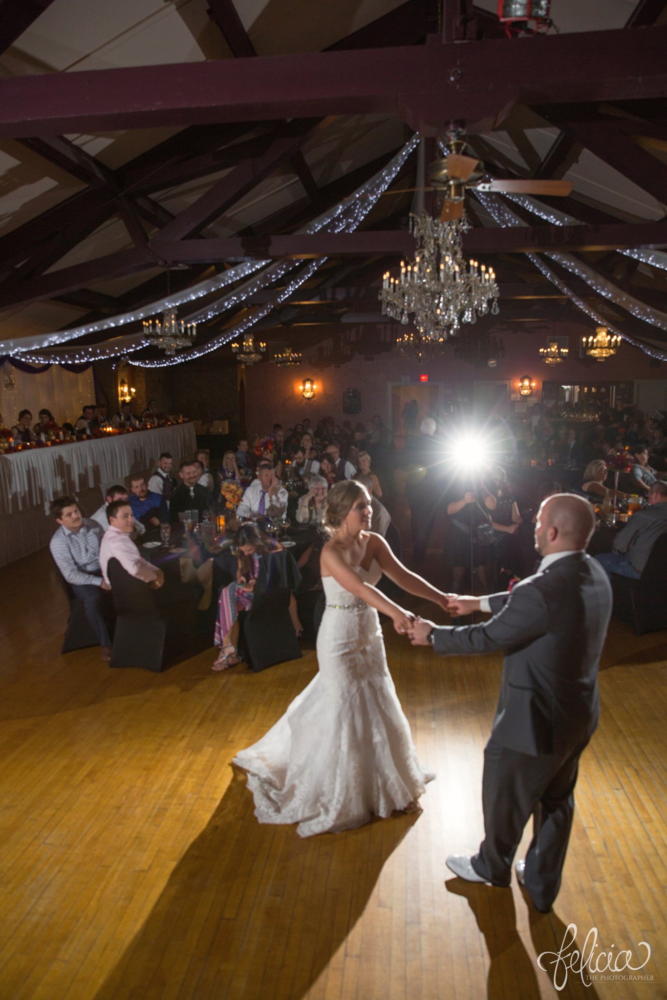 weddings | wedding photography | wedding photos | images by feliciathephotographer.com | St. Francis Xavier Church | Moila Country Club | autumn wedding | fall wedding | fall colors | harvest | purple and orange | Kansas City | St. Joseph | harvest inspiration | reception activities | first dance | candid | twirl | chandeliers | wooden beams 