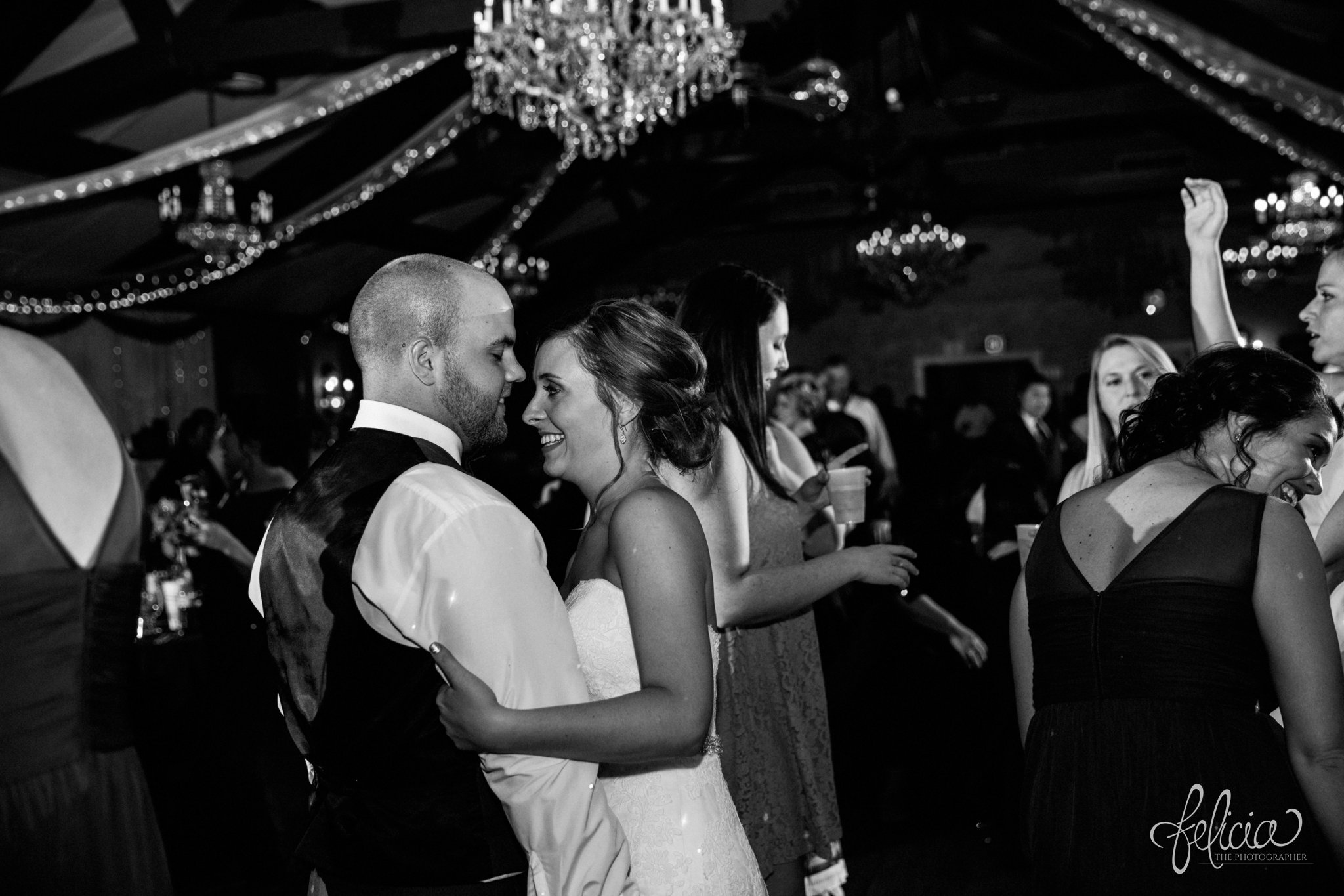 black and white | weddings | wedding photography | wedding photos | images by feliciathephotographer.com | St. Francis Xavier Church | Moila Country Club | autumn wedding | fall wedding | fall colors | harvest | purple and orange | Kansas City | St. Joseph | harvest inspiration | reception activities | Memory Maker Productions | dance floor | candid | bride and groom | Memory Maker Productions | chandelier 