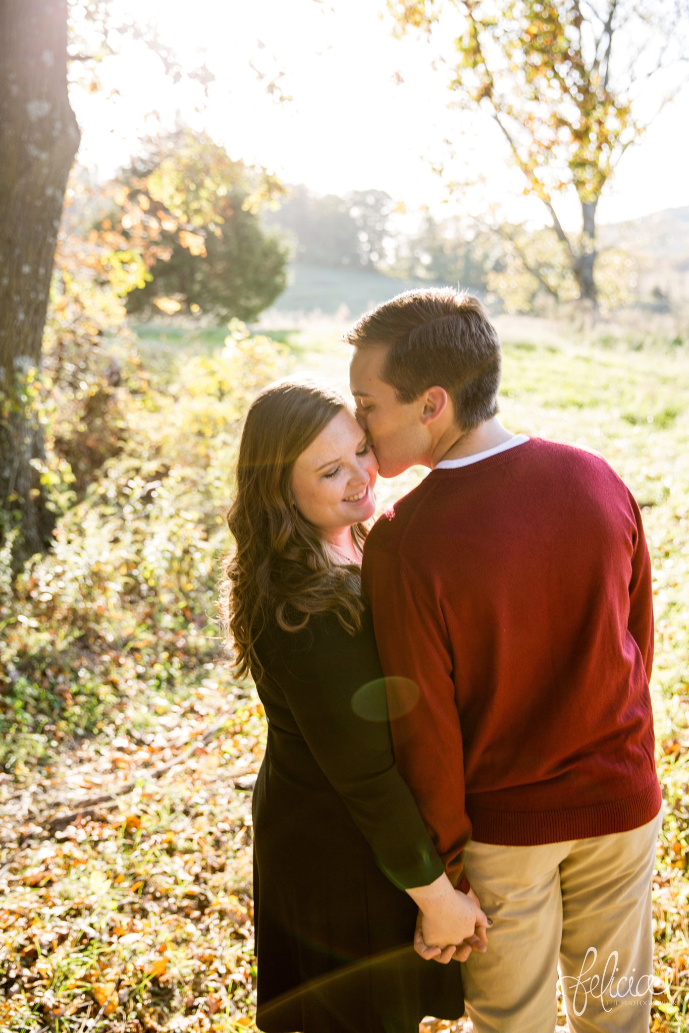 engagement photos | engagement photography | Felicia the Photographer | images by feliciathephotographer.com | sun flare | farm | nature | cowboy boots | kiss on cheek | closed eyes | holding hands 