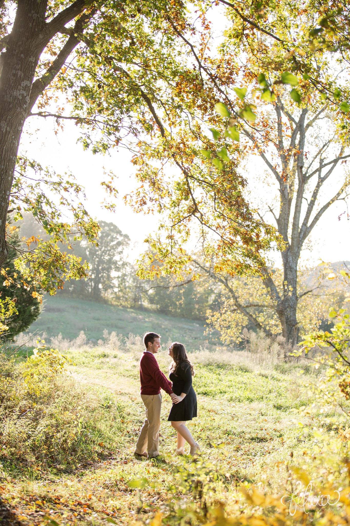 engagement photos | fall engagement photos | engagement photography | Felicia the Photographer | images by feliciathephotographer.com | sun flare | farm | nature | fall leaves | dancing | dancing in a field 