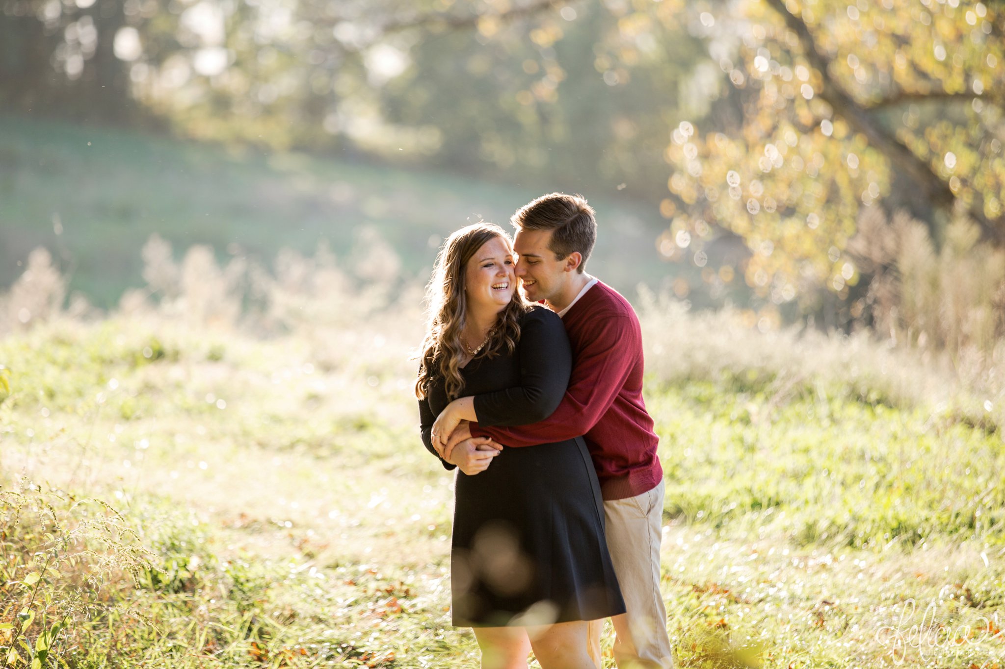 engagement photos | fall engagement photos | engagement photography | Felicia the Photographer | images by feliciathephotographer.com | sun flare | farm | nature | fall leaves | hugging | candid 