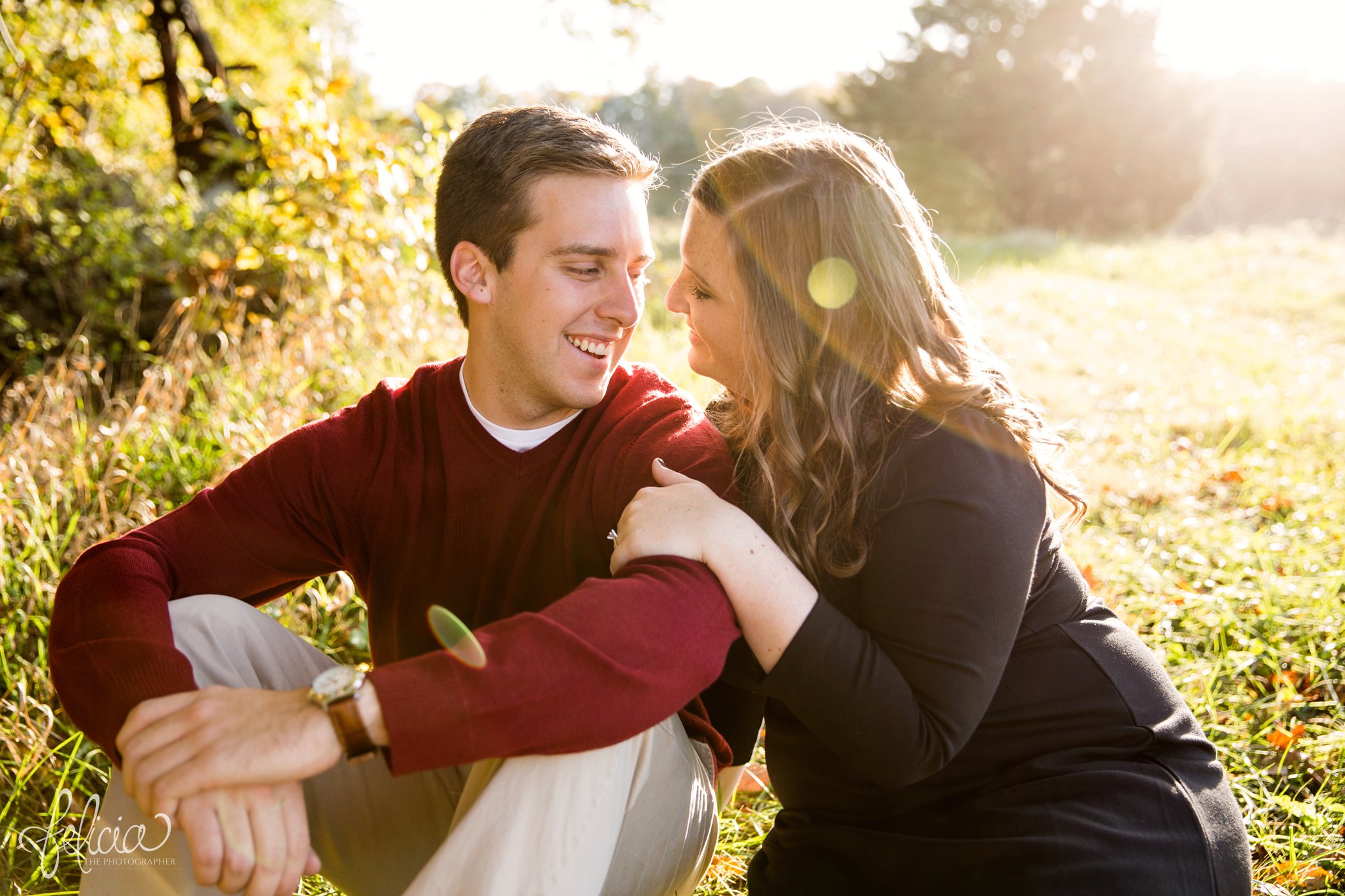 engagement photos | fall engagement photos | engagement photography | Felicia the Photographer | images by feliciathephotographer.com | sun flare | farm | nature | fall leaves | sitting in field | candid | cuddling