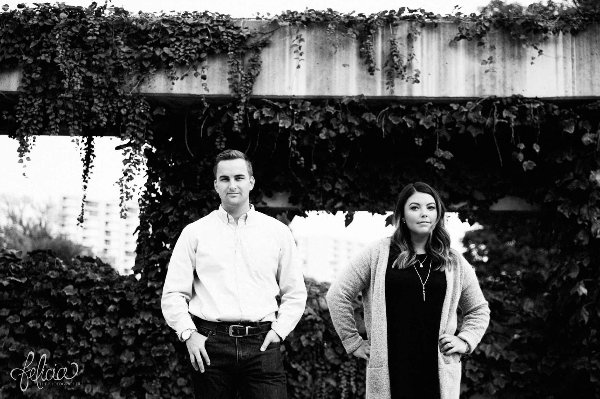 black and white | engagement photos | engagement photography | Kansas City | images by feliciathephotographer.com | architectural backgrounds | happy couple | ivy wall | serious pose | model pose 
