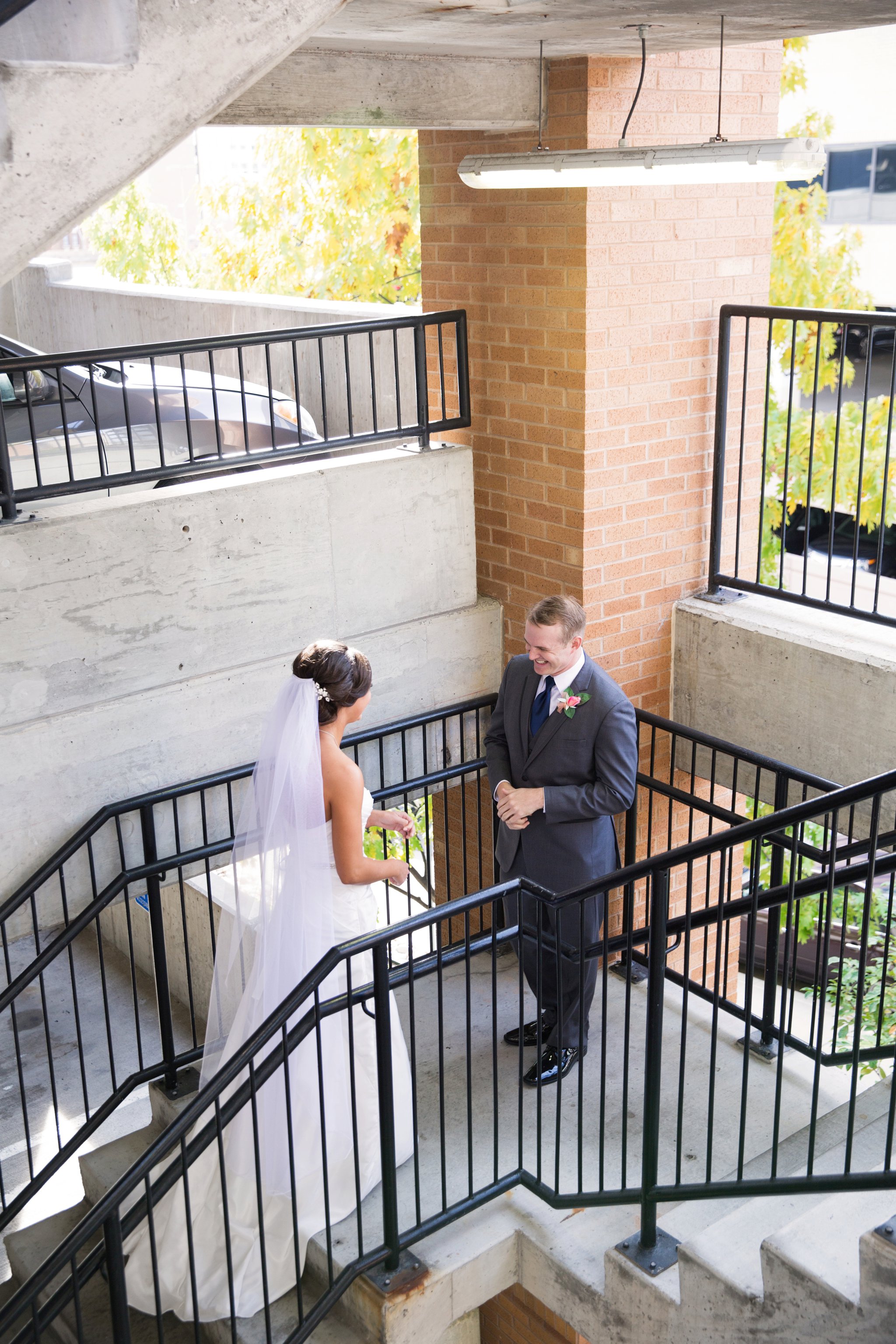 wedding | wedding photos | wedding photography | images by feliciathephotographer.com | Country Club Plaza | Kansas City | Unity Temple | first look | bride and groom | staircase meeting | groom reaction 