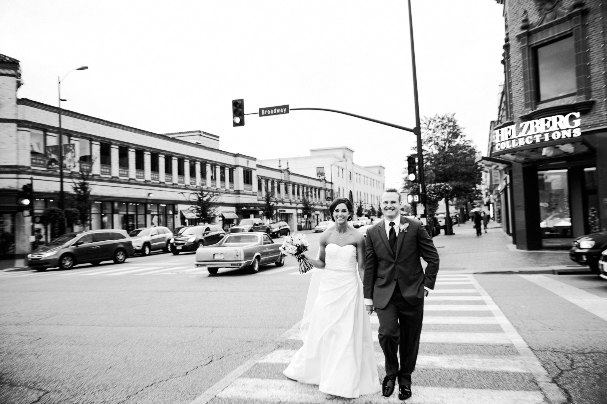 black and white | wedding | wedding photos | wedding photography | images by feliciathephotographer.com | Country Club Plaza | Kansas City | Unity Temple | crosswalk | candid | man and wife | Broadway 
