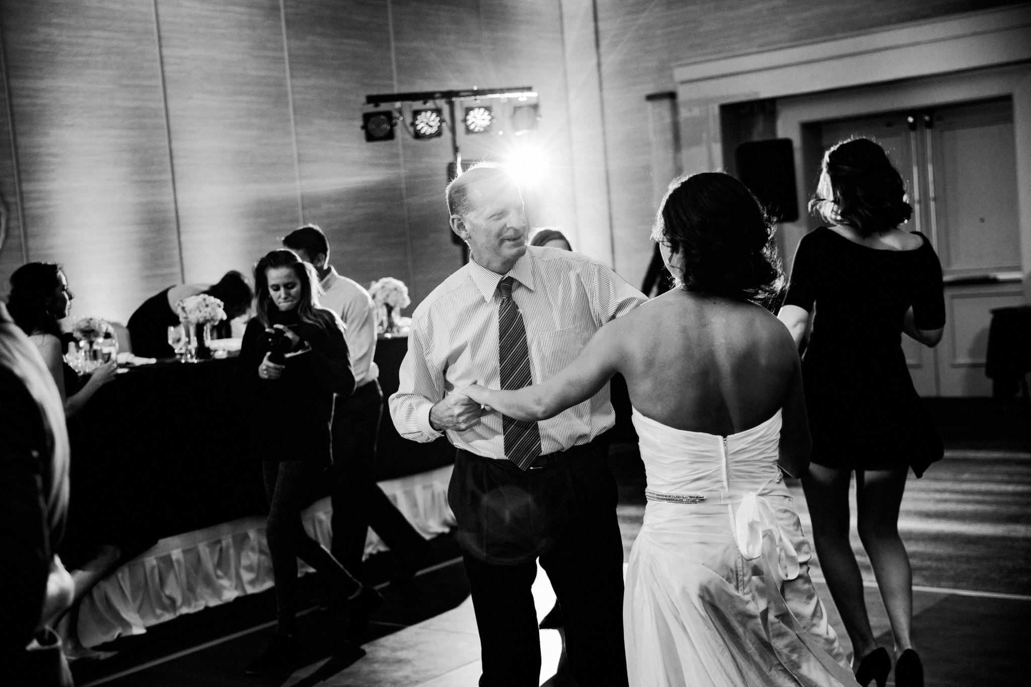 black and white | wedding | wedding photos | wedding photography | images by feliciathephotographer.com | Country Club Plaza | Kansas City | The Marriott | Unity Temple | reception venue | reception activities | dance floor | candid | guests dancing | Jukeboxx Media | dancing bride | dancing father of the bride | father daughter dance 