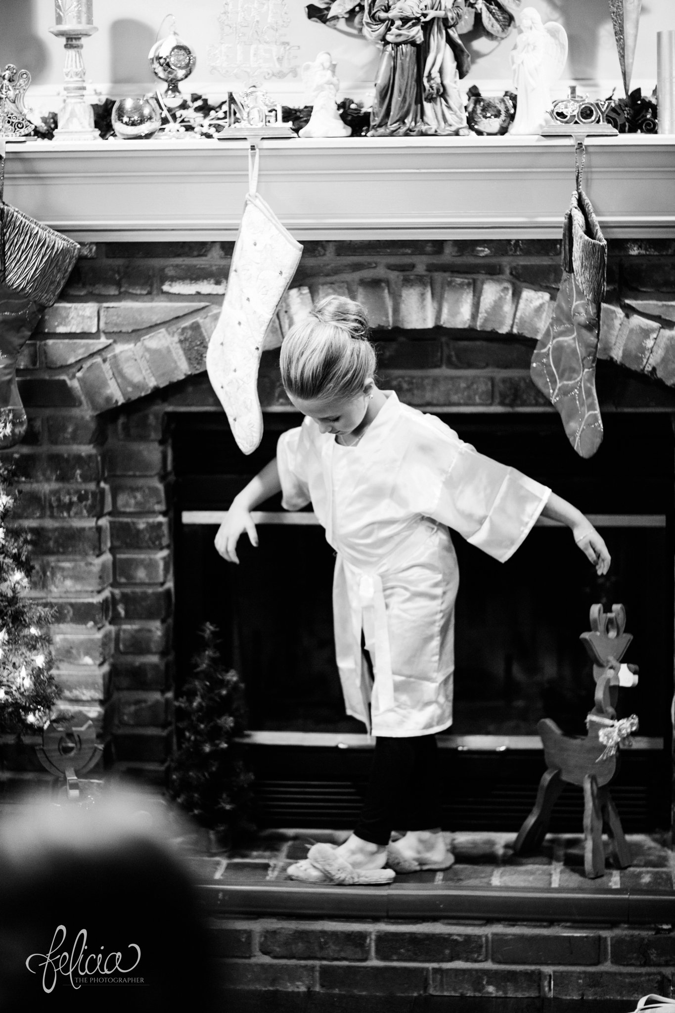 black and white | wedding | wedding photography | wedding photos | Kansas City | St. Patrick's Catholic Church | Hawthorne House | images by feliciathephotographer.com | crimson wedding | Christmas Wedding | getting ready | wedding prep | candid | flower girl | stone fireplace | Christmas stockings 