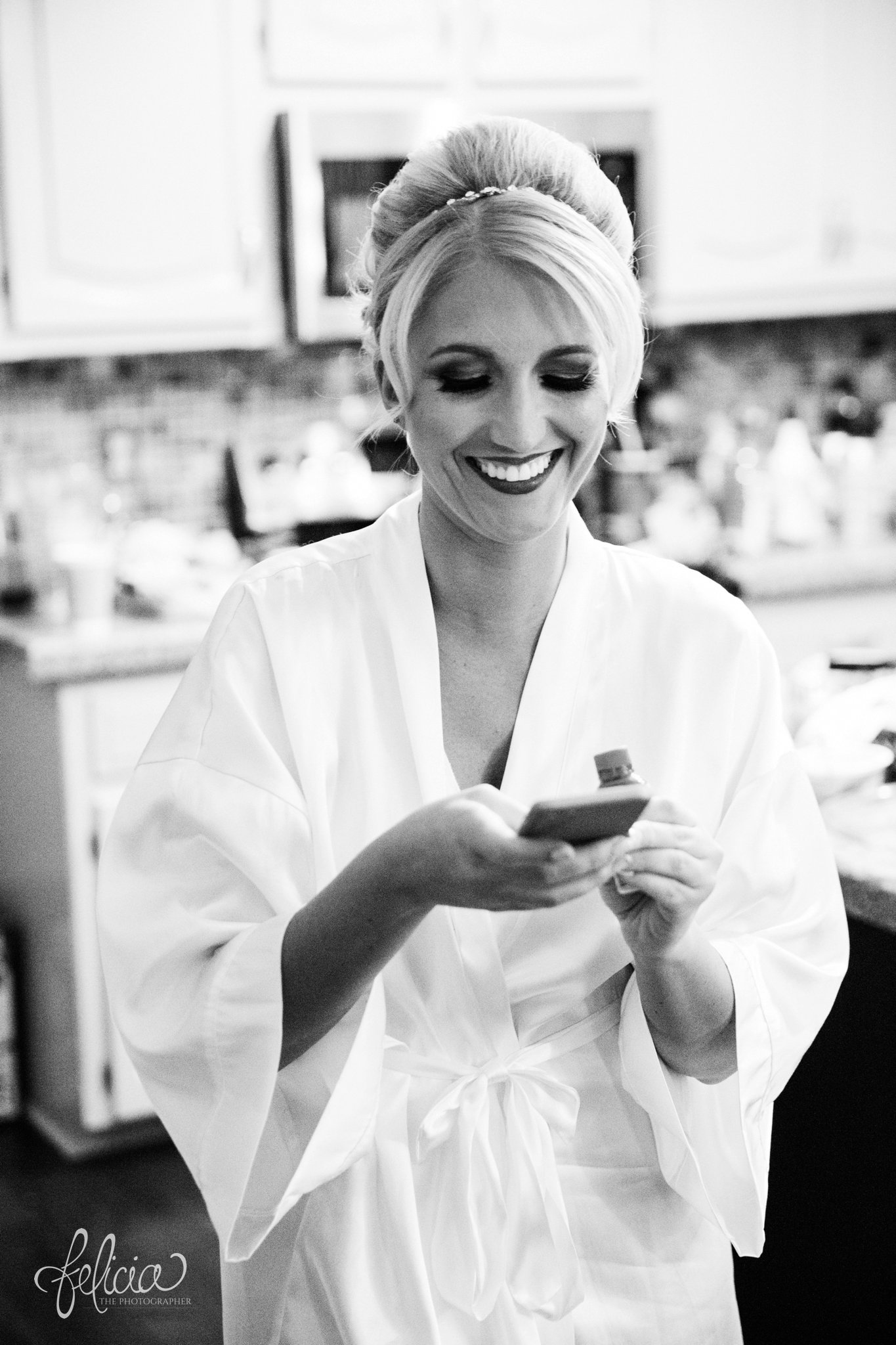 black and white | wedding | wedding photography | wedding photos | Kansas City | St. Patrick's Catholic Church | Hawthorne House | images by feliciathephotographer.com | crimson wedding | Christmas Wedding | getting ready | wedding prep | candid | smiling bride | bridal robe 