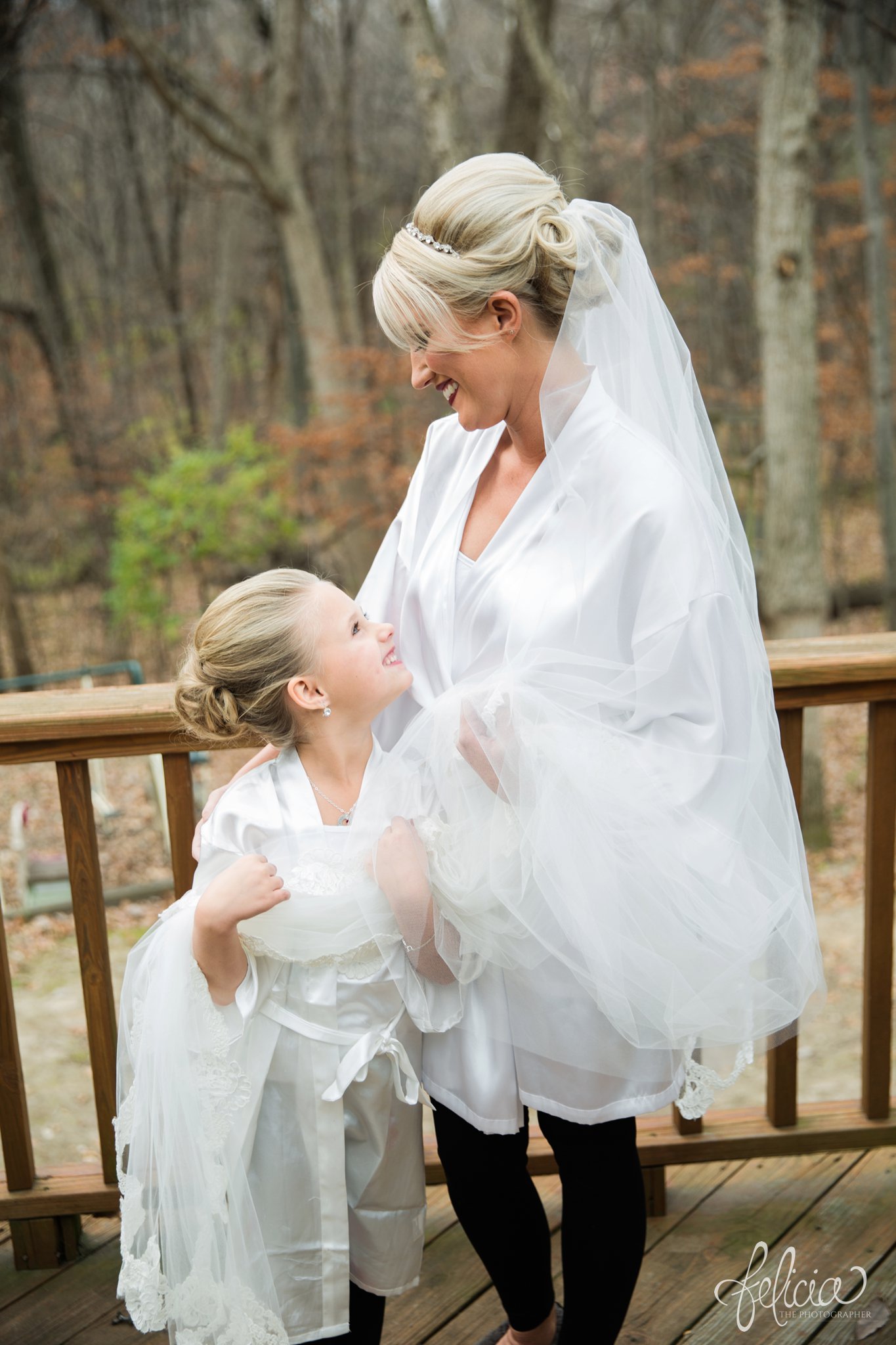 wedding | wedding photography | wedding photos | Kansas City | St. Patrick's Catholic Church | Hawthorne House | images by feliciathephotographer.com | crimson wedding | Christmas Wedding | bride with flower girl | nature background | getting ready | wedding prep 