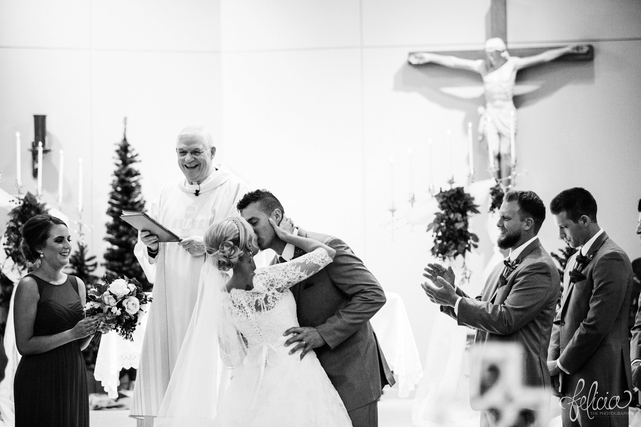 black and white | wedding | wedding photography | wedding photos | Kansas City | St. Patrick's Catholic Church | Hawthorne House | images by feliciathephotographer.com | crimson wedding | Christmas Wedding | ceremony | bride and groom at altar | first kiss 