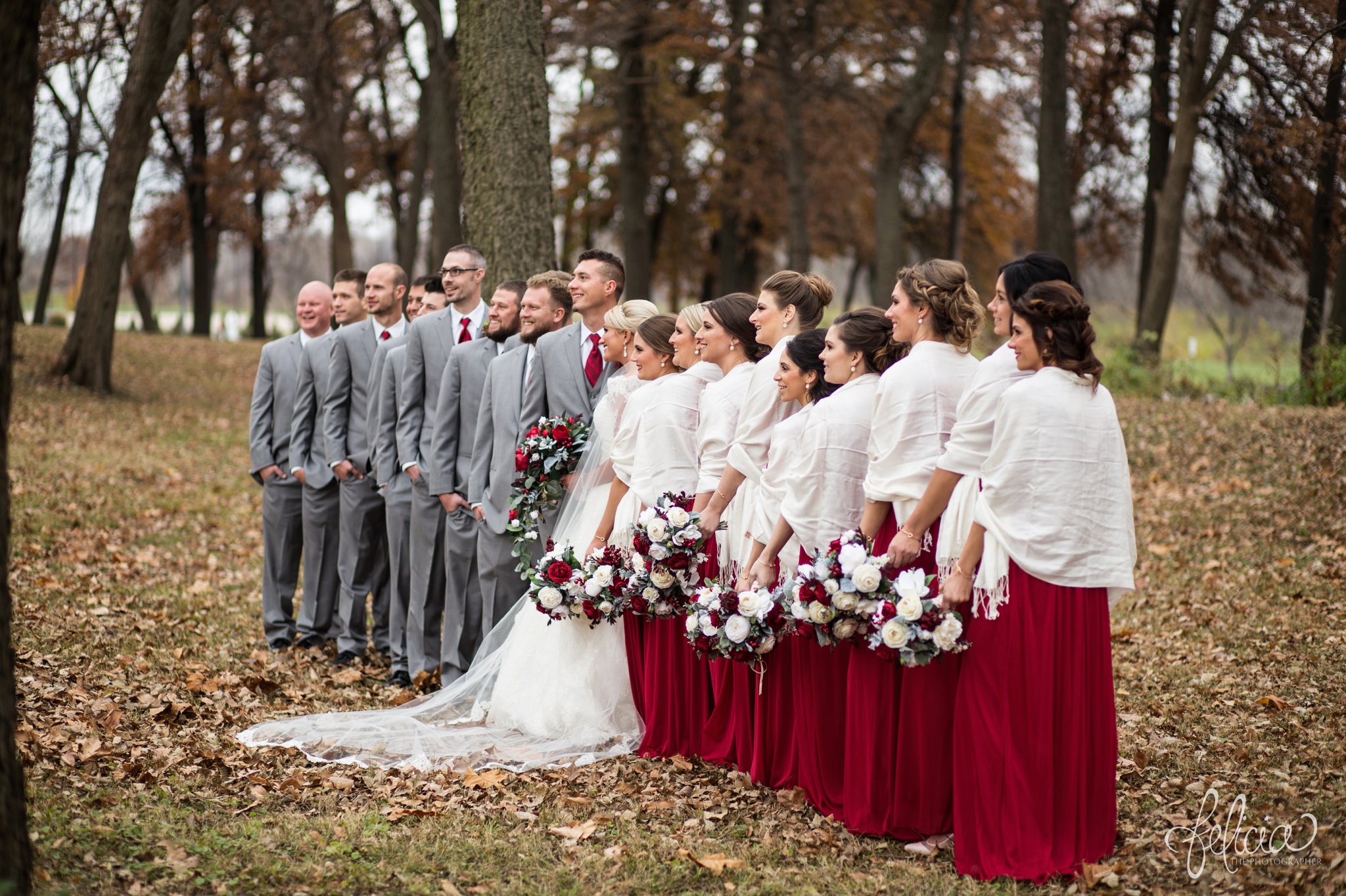 wedding | wedding photography | wedding photos | Kansas City | St. Patrick's Catholic Church | Hawthorne House | images by feliciathephotographer.com | crimson wedding | Christmas Wedding | winter portraits | nature background | bridal party portrait | crimson bridesmaid dresses | dramatic veil | unique poses | white shawls