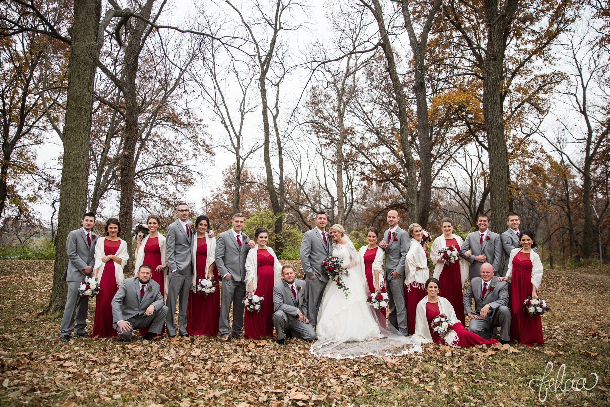 wedding | wedding photography | wedding photos | Kansas City | St. Patrick's Catholic Church | Hawthorne House | images by feliciathephotographer.com | crimson wedding | Christmas Wedding | winter portraits | nature background | bridal party portrait | crimson bridesmaid dresses | dramatic veil | unique poses 