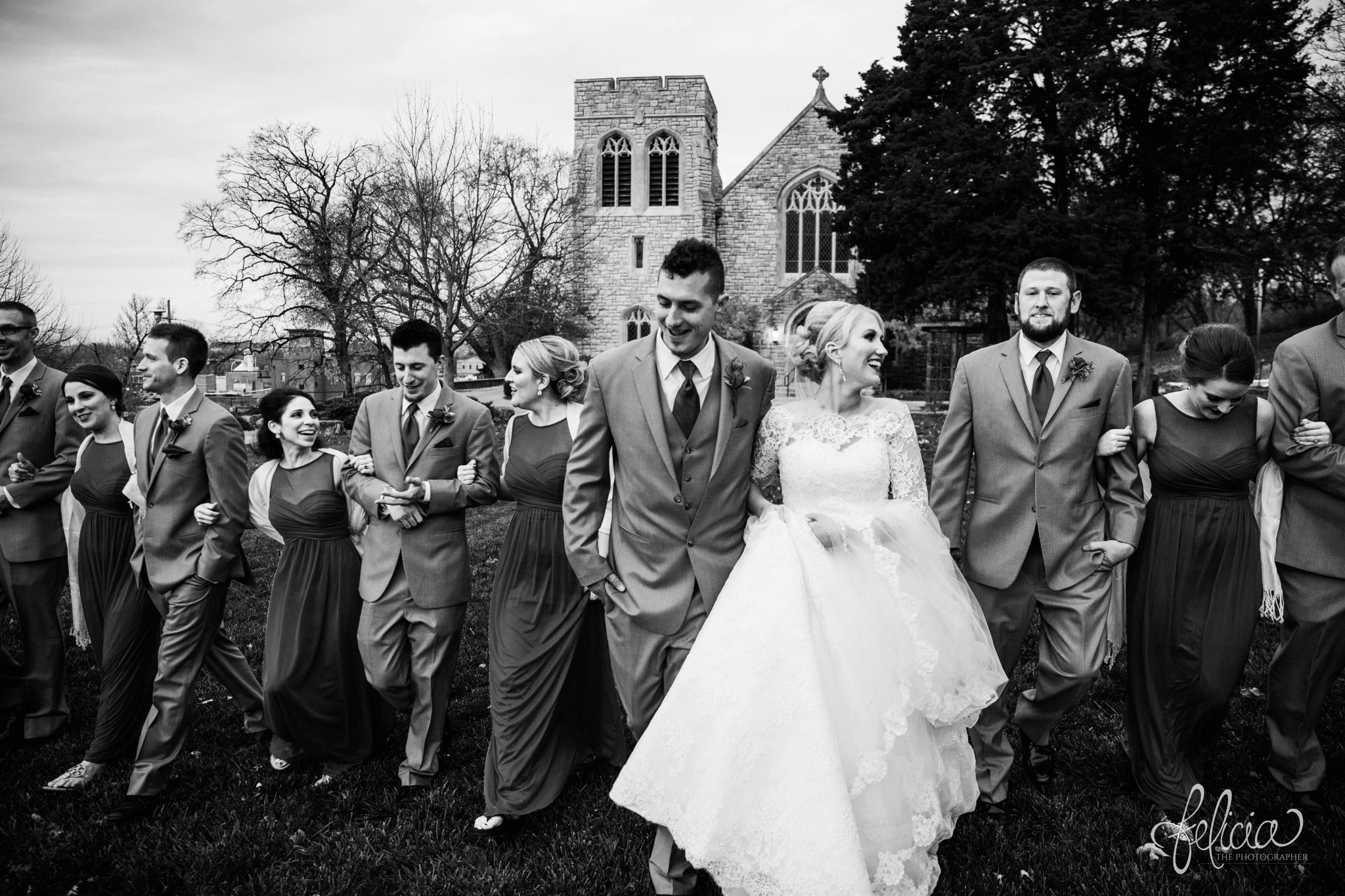 black and white | wedding | wedding photography | wedding photos | Kansas City | St. Patrick's Catholic Church | Hawthorne House | images by feliciathephotographer.com | crimson wedding | Christmas Wedding | winter portraits | church background | bridal party | candid | linked arms 