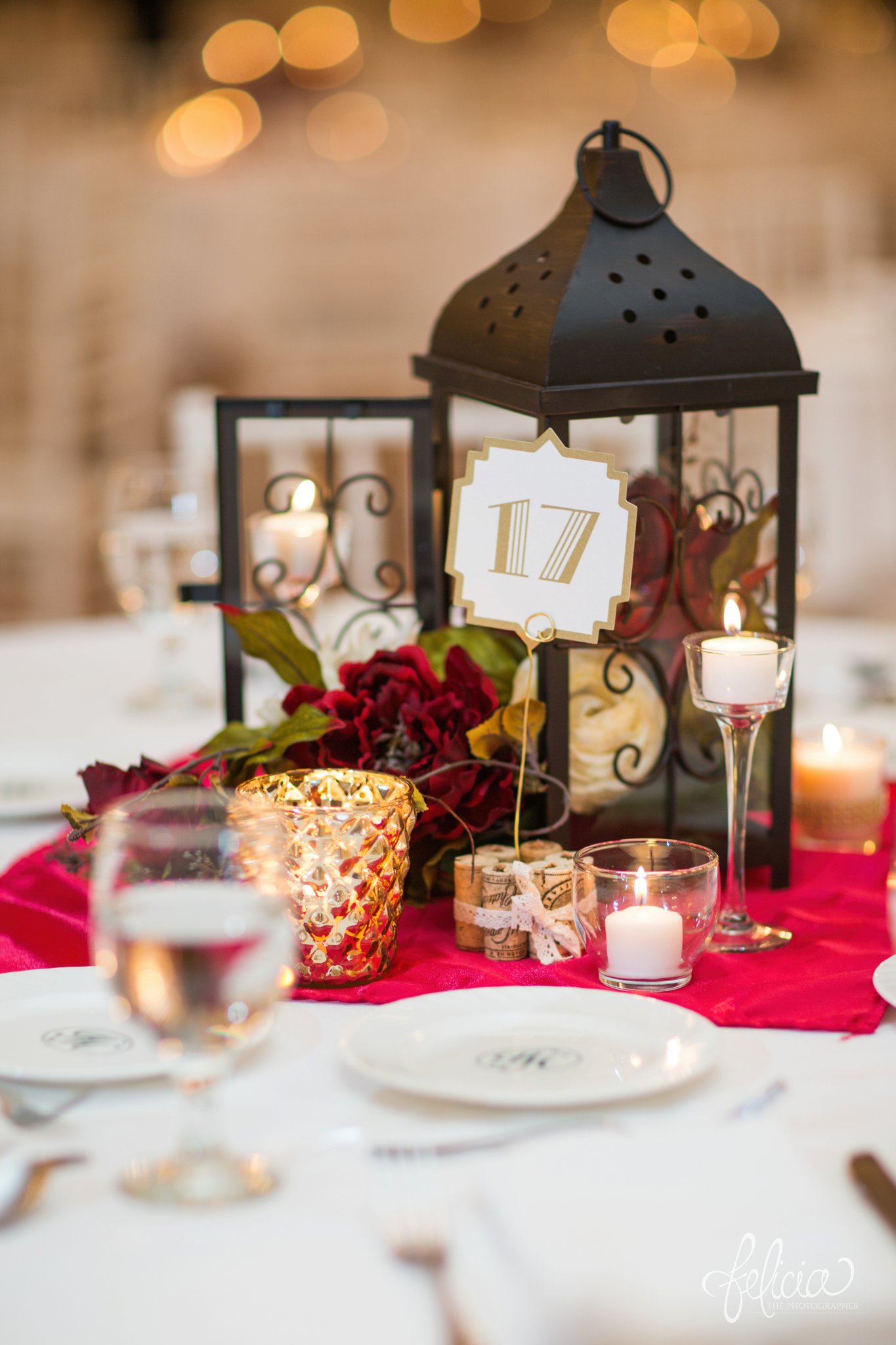 wedding | wedding photography | wedding photos | Kansas City | Hawthorne House | images by feliciathephotographer.com | crimson wedding | Christmas Wedding | red roses | reception decor | centerpieces | gold candle holder | lantern | table numbers | red and white roses 