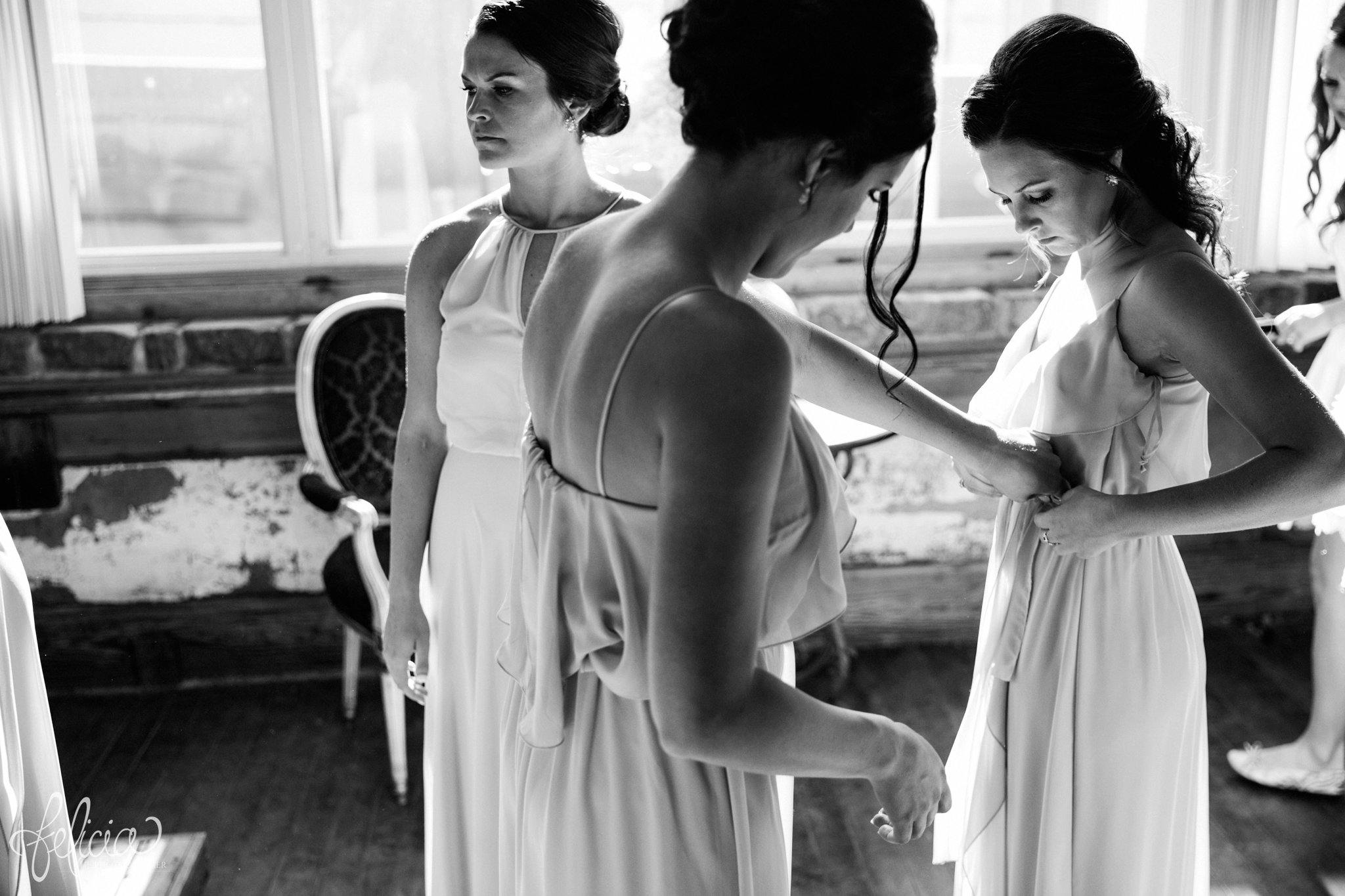 black and white | wedding | wedding photos | industrial | Rumely Event Space | wedding photography | images by feliciathephotographer.com | West Bottoms | getting ready | wedding prep | bridesmaid dresses | Grecian | candid 
