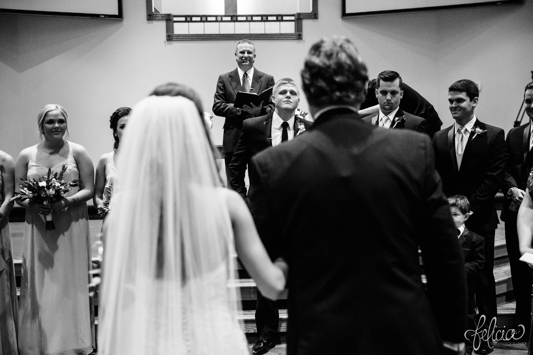 black and white | wedding | wedding photos | industrial | Rumely Event Space | wedding photography | images by feliciathephotographer.com | West Bottoms | wedding ceremony | The Providence Baptist Church | bride arrival | here comes the bride | father of the bride | walking down the aisle | groom reaction