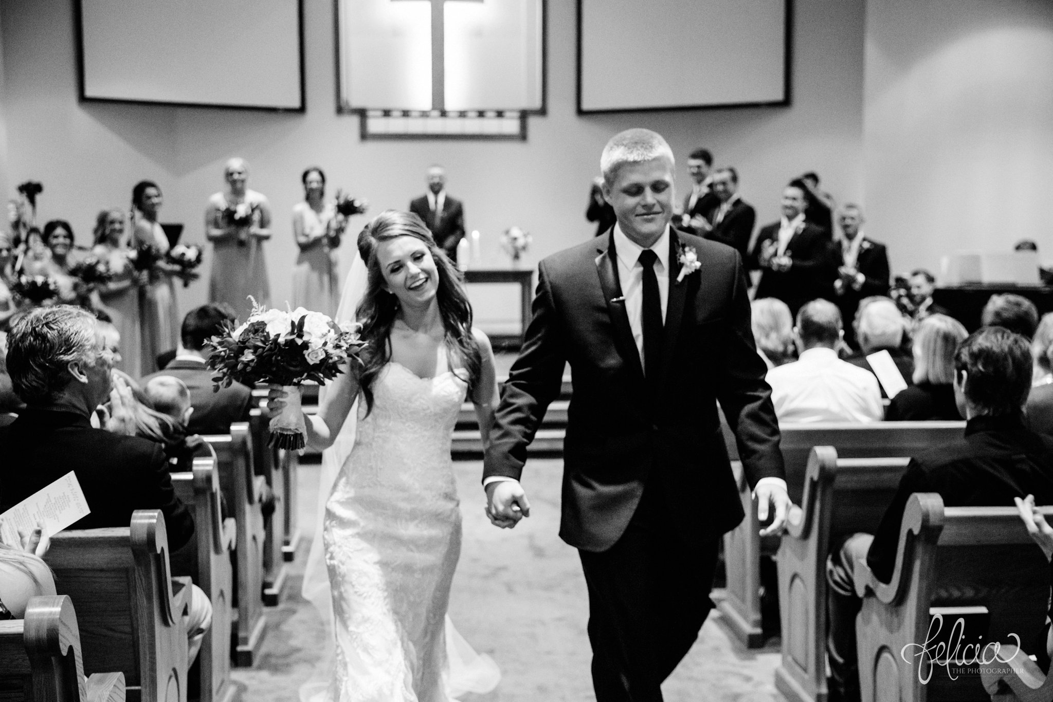 black and white | wedding | wedding photos | industrial | Rumely Event Space | wedding photography | images by feliciathephotographer.com | West Bottoms | wedding ceremony | The Providence Baptist Church | bride and groom | Mr. and Mrs. | walking down the aisle 