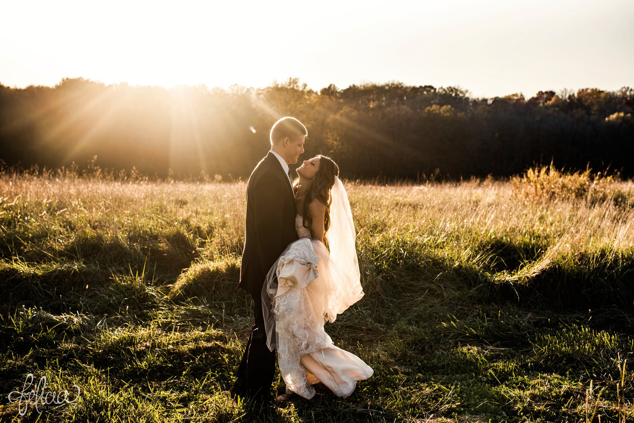 wedding | wedding photos | Rumely Event Space | wedding photography | images by feliciathephotographer.com | field background | nature | bride and groom portraits | sunlight | romantic sun | sun flare | care free | billowing dress | smiling | candid 