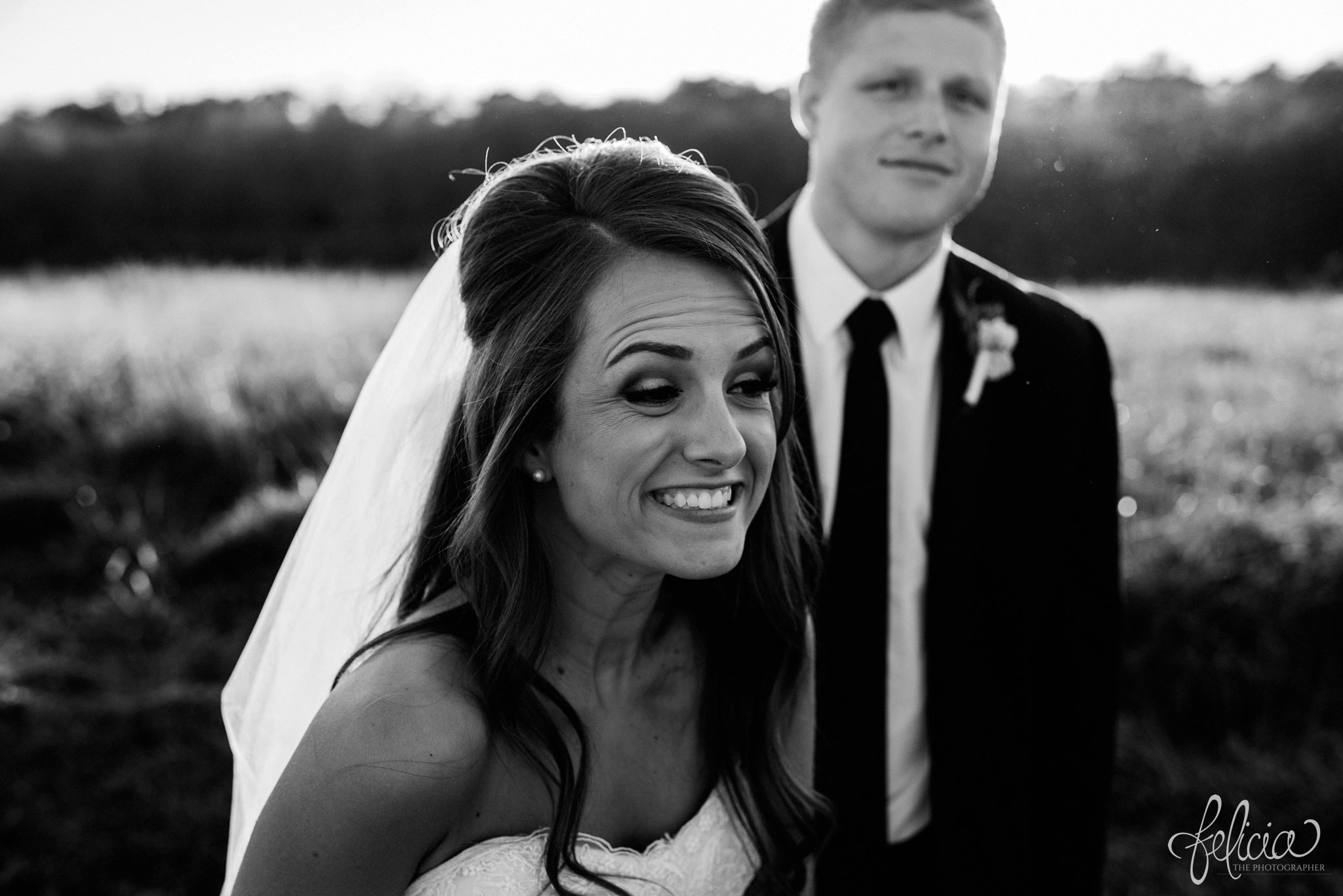 black and white | wedding | wedding photos | Rumely Event Space | wedding photography | images by feliciathephotographer.com | field background | nature | bride and groom portraits | sunlight | smiling bride | candid 