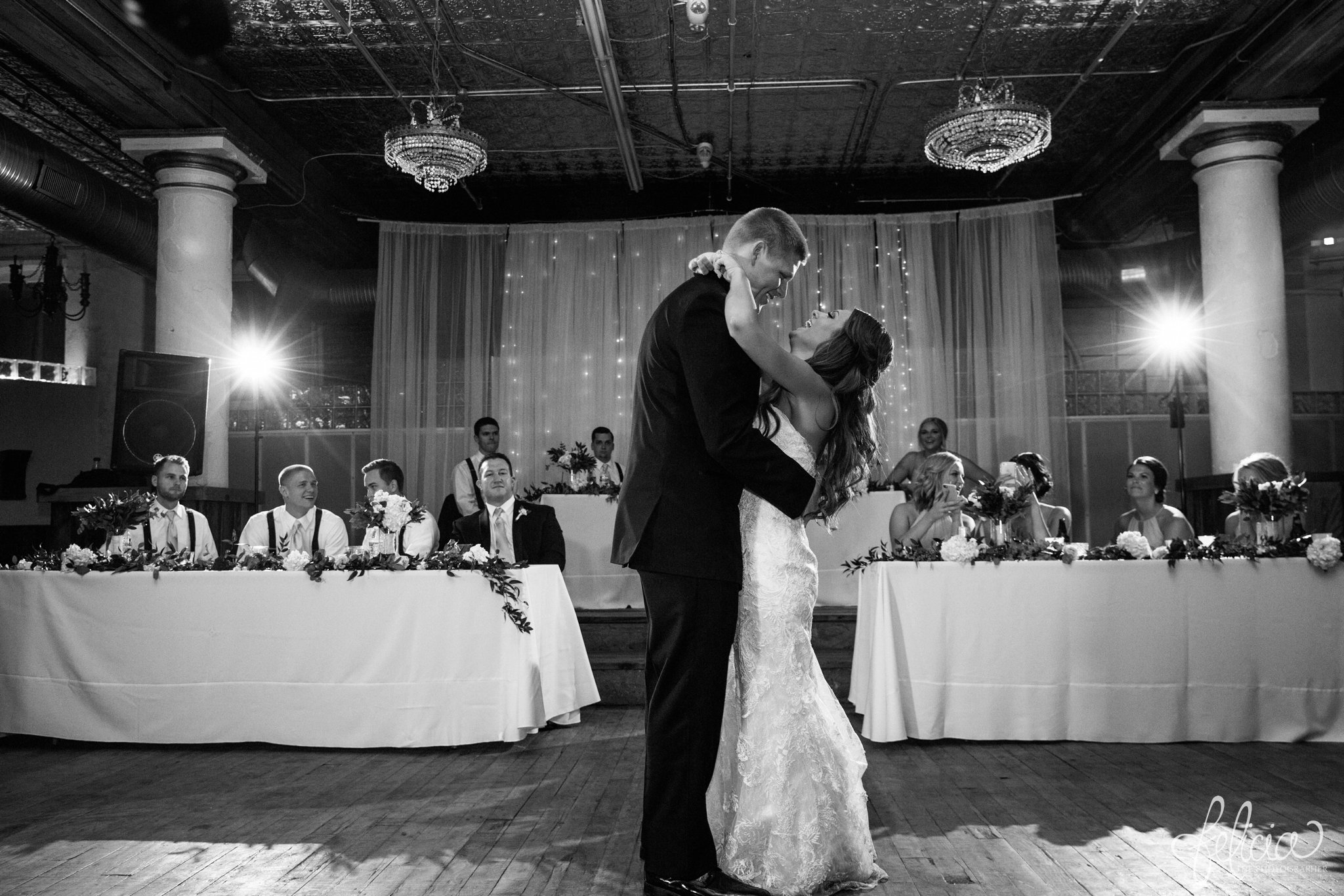 black and white | wedding | wedding photos | Rumely Event Space | wedding photography | images by feliciathephotographer.com | historic venue | wedding reception | first dance | candid | high ceilings | chandeliers | tile ceilings 