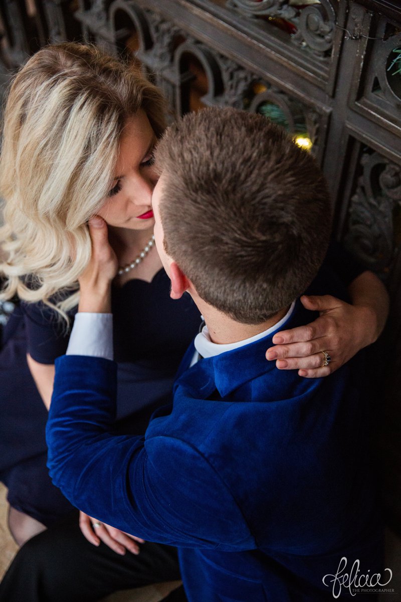 engagement photos | night engagement photos | Union Station | Kansas City | images by feliciathephotographer.com | romantic engagement | hugging pose | dramatic background | scallop neck dress | pearl accessories | blue blazer | romantic poses | intricate backgrounds | Old Hollywood 